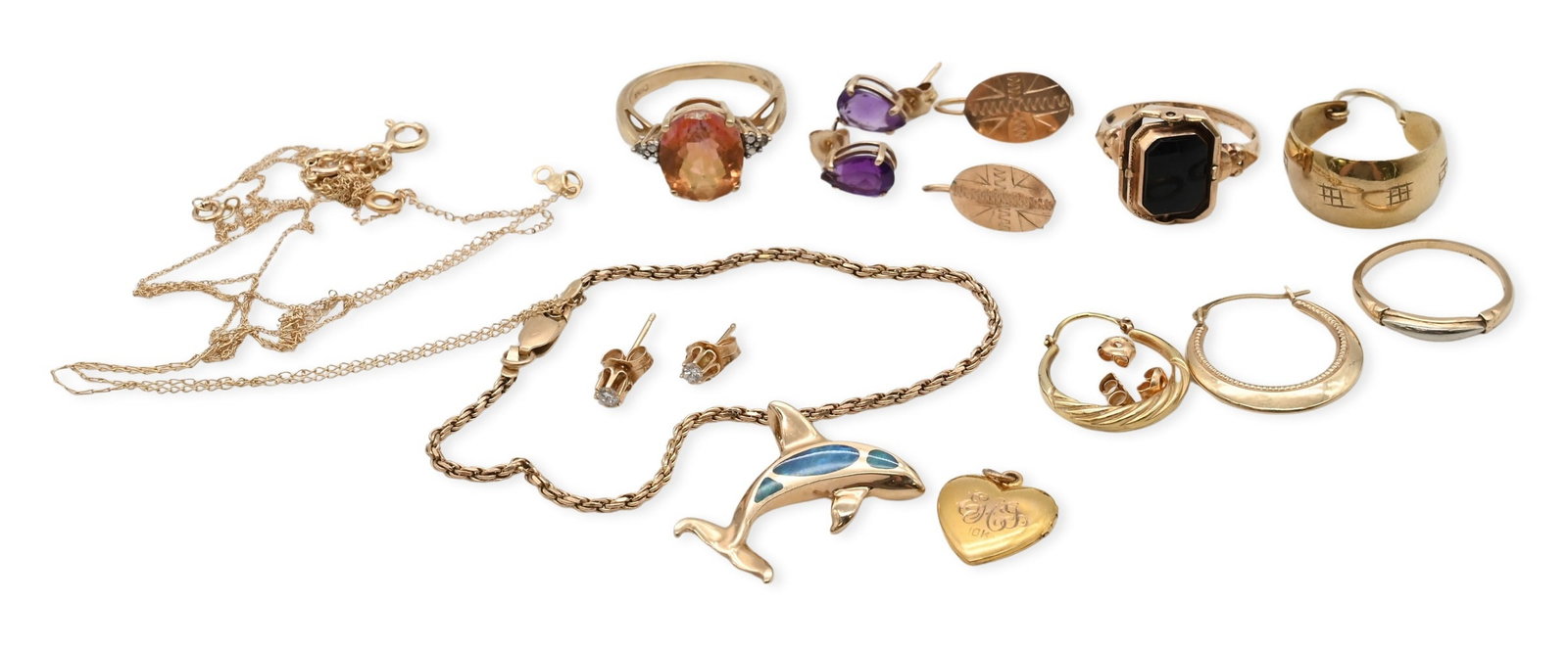 Group of 14K and 10K Gold Jewelry: Group of 14K and 10K Gold Jewelry to include 14K gold dolphin pendant, rope bracelet, pair of diamond stud earrings, pair of amethyst earrings, pair of oval earrings,and other single earrings and find