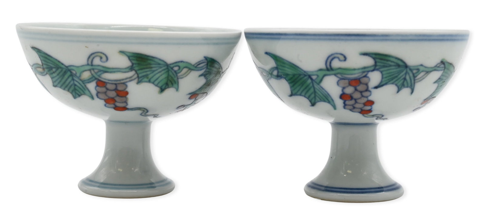 Pair of Chinese Chenghua Style Doucai Stem Cups: Pair of Chinese Chenghua Style Doucai Stem Cups decorated by grapevines bearing clusters of grapes and scrolling leaves, each bearing a Chenghua blue and white mark to the underside Height 2 1/2 inche