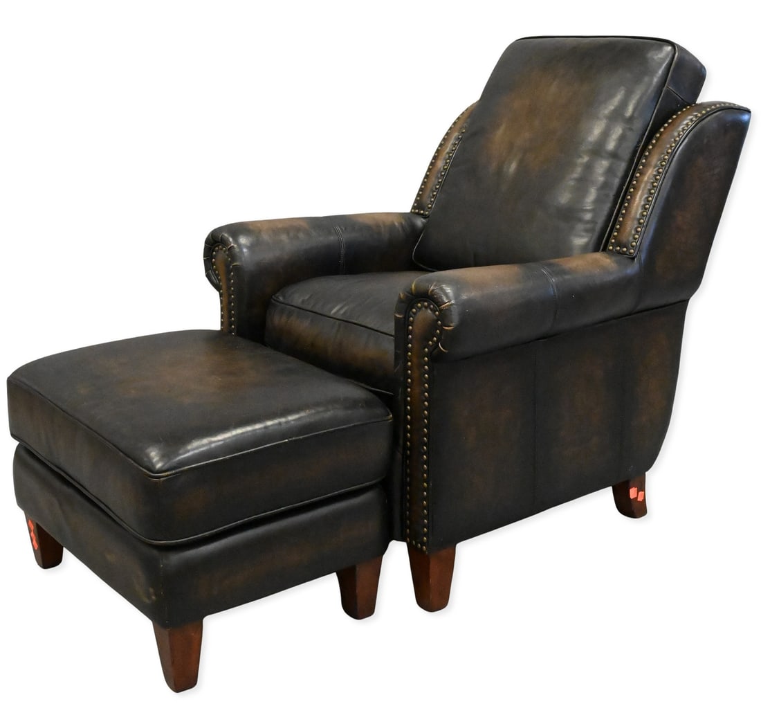 Thomasville Leather Armchair and Ottoman: Thomasville Leather Armchair and Ottoman in distressed dark brown leather featuring nailhead accents height of chair 40 inches, width 35 inches, depth 40 inches