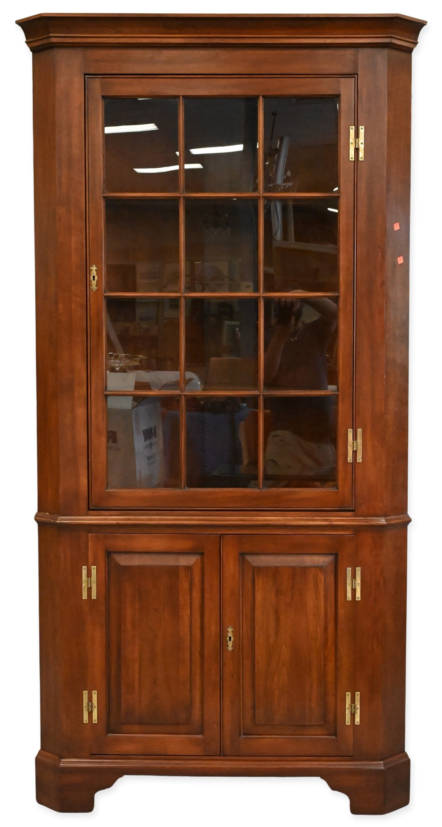 Virginia Galleries Henkel Harris Corner Cabinet: Virginia Galleries Henkel Harris Corner Cabinet solid black cherry, having glass doors on the upper part with curved shelving. The bottom has solid doors. 83 1/2" high.