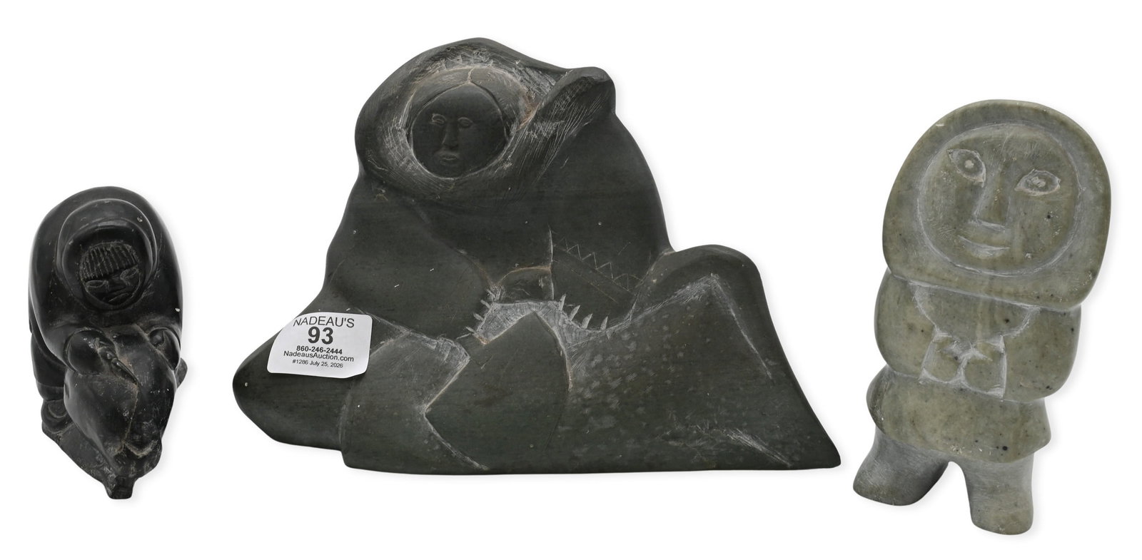 Three Inuit Figural Soapstone Carvings: Three Inuit Figural Soapstone Carvings to include Annie Niviaxie (Canadian Inuit Inukjuak 1930-1989) "Standing Woman", 1983 Carved green soapstone Signed and dated to underside in Inuktitut, along wit