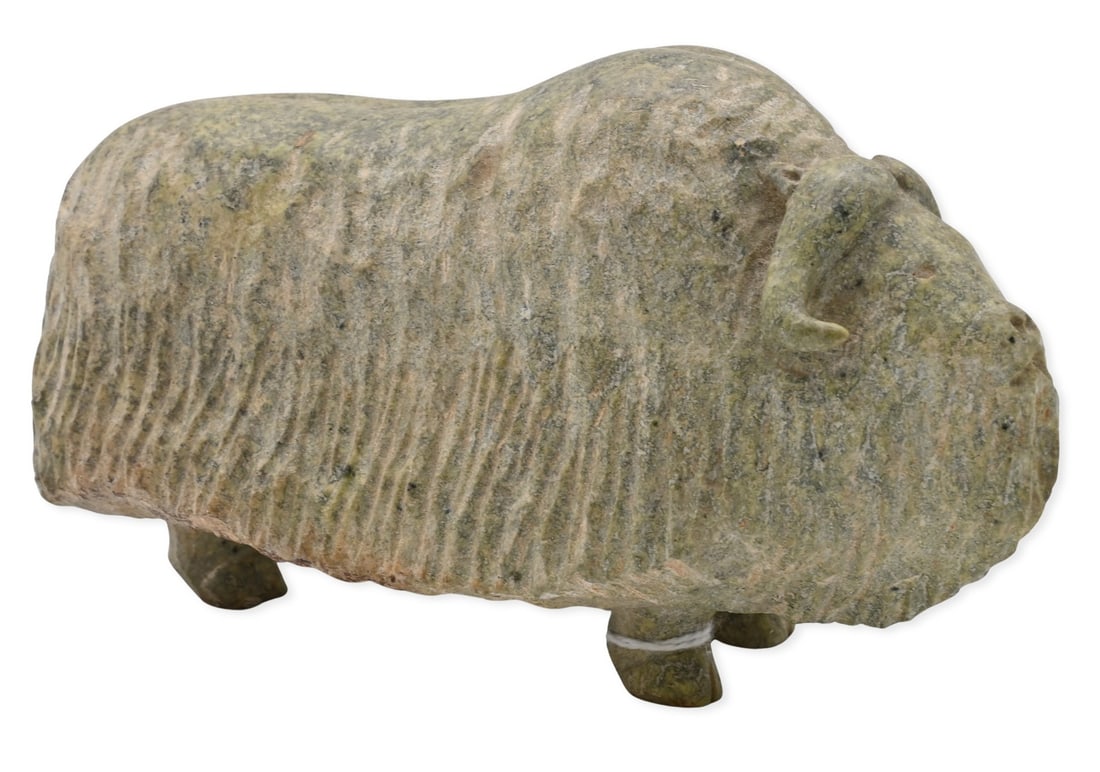 Manasie Akpaliapik (Canadian Inuit Nunavut B.1955): Manasie Akpaliapik (Canadian Inuit Nunavut B.1955) "Muskox" Carved green soapstone Signed to underside M Akpaliapik and in Inuktitut Height 3 1/2 inches, length 6 1/2 inches
