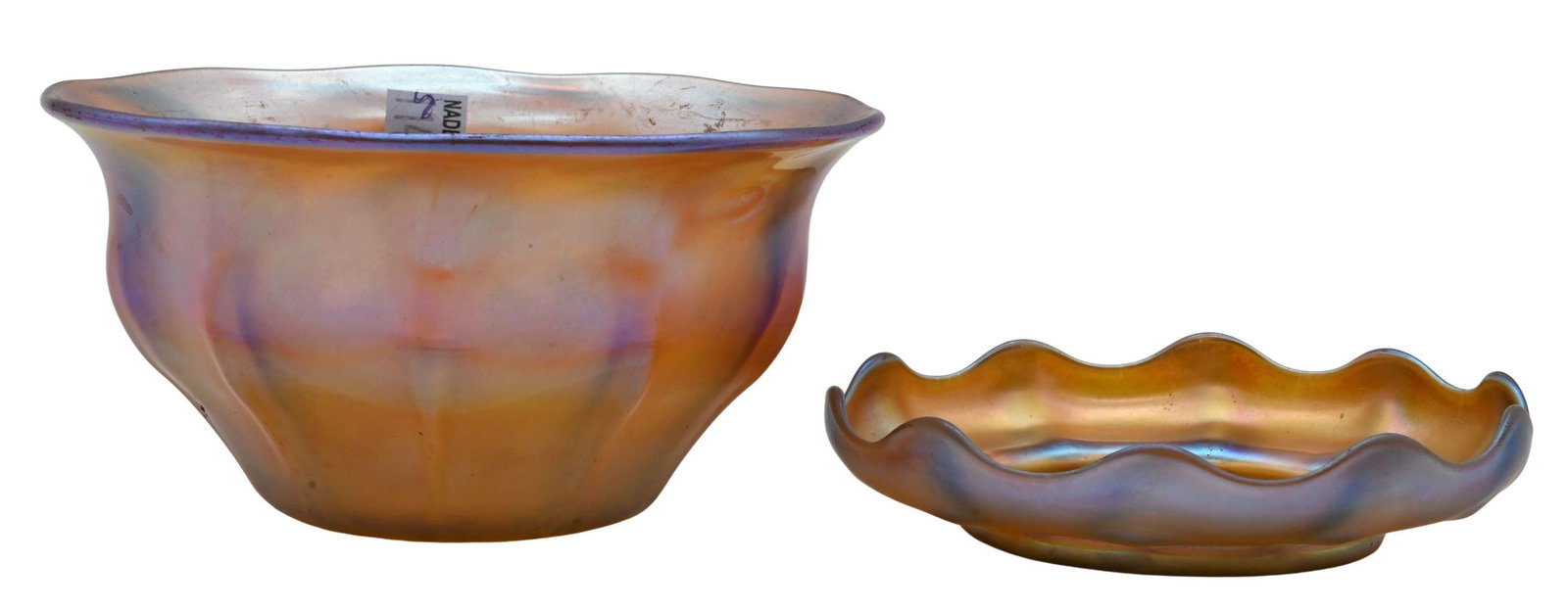 Two Tiffany Studios Favrile Glass Pieces: Two Tiffany Studios Favrile Glass Pieces to include Favrile glass bowl of circular form having a lobed rim, decorated in gold iridescence with pink, blue, and green highlights, signed L.C. Tiffany –
