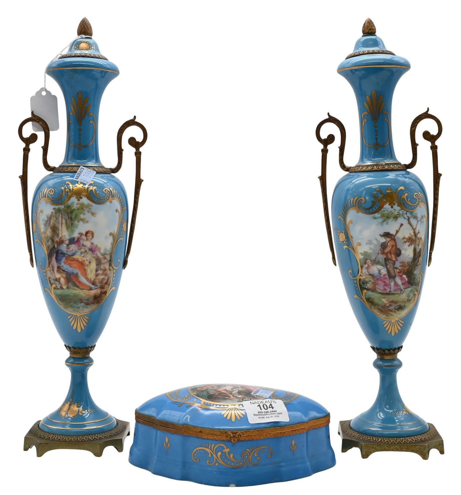 Three Piece Sevres Style Blue Porcelain Garniture Set: Three Piece Sevres Style Blue Porcelain Garniture Set Comprising a pair of covered urns and matching covered box, each decorated in hand-painted figural reserves and gilt accents, marked Sevres to und