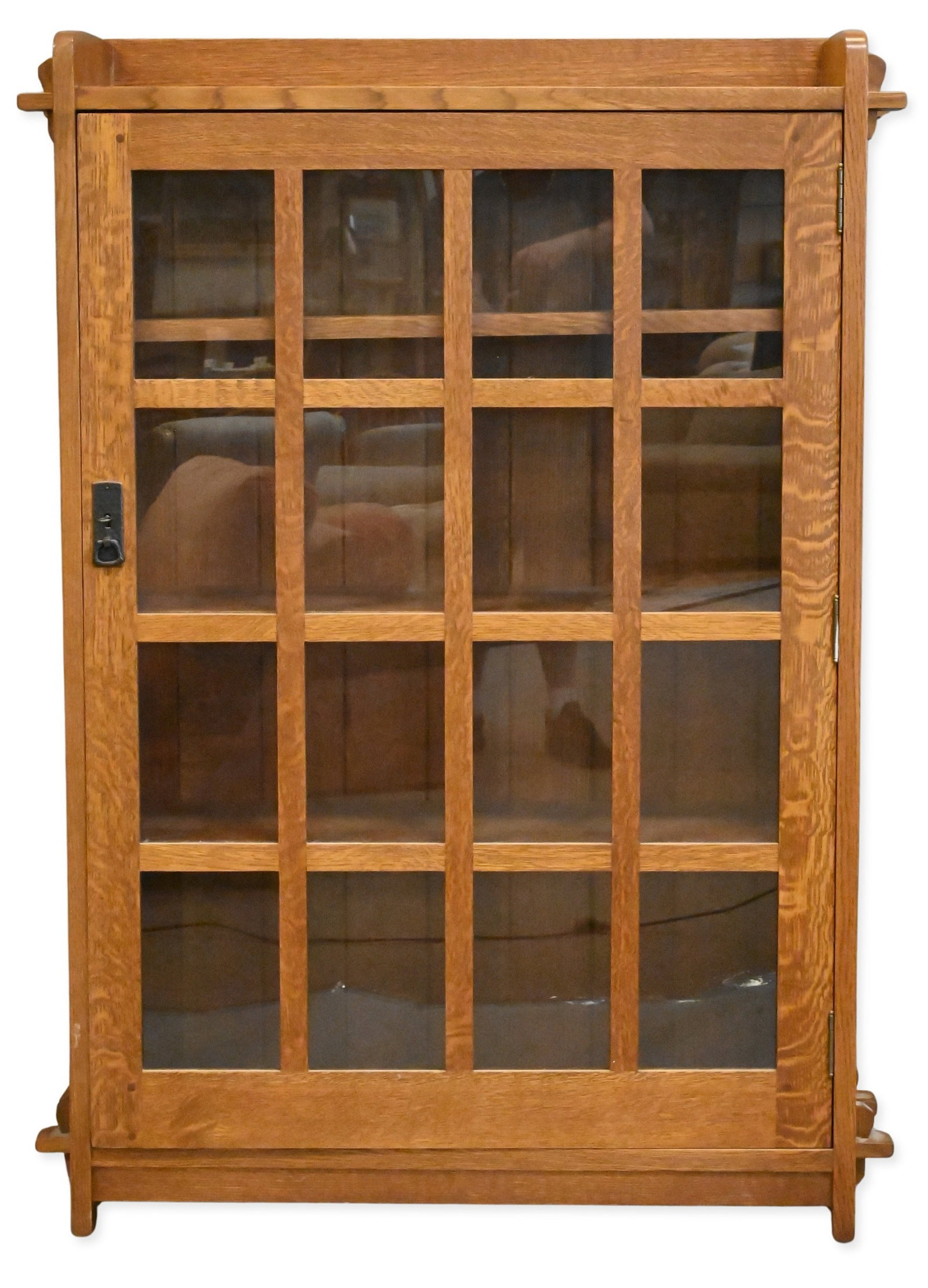Stickley Mission Oak Single Door Bookcase: Stickley Mission Oak Single Door Bookcase having a glazed door and geometric muntins, overhanging top featuring exposed through-tenon joinery, and adjustable interior shelving, retaining Stickley Hand
