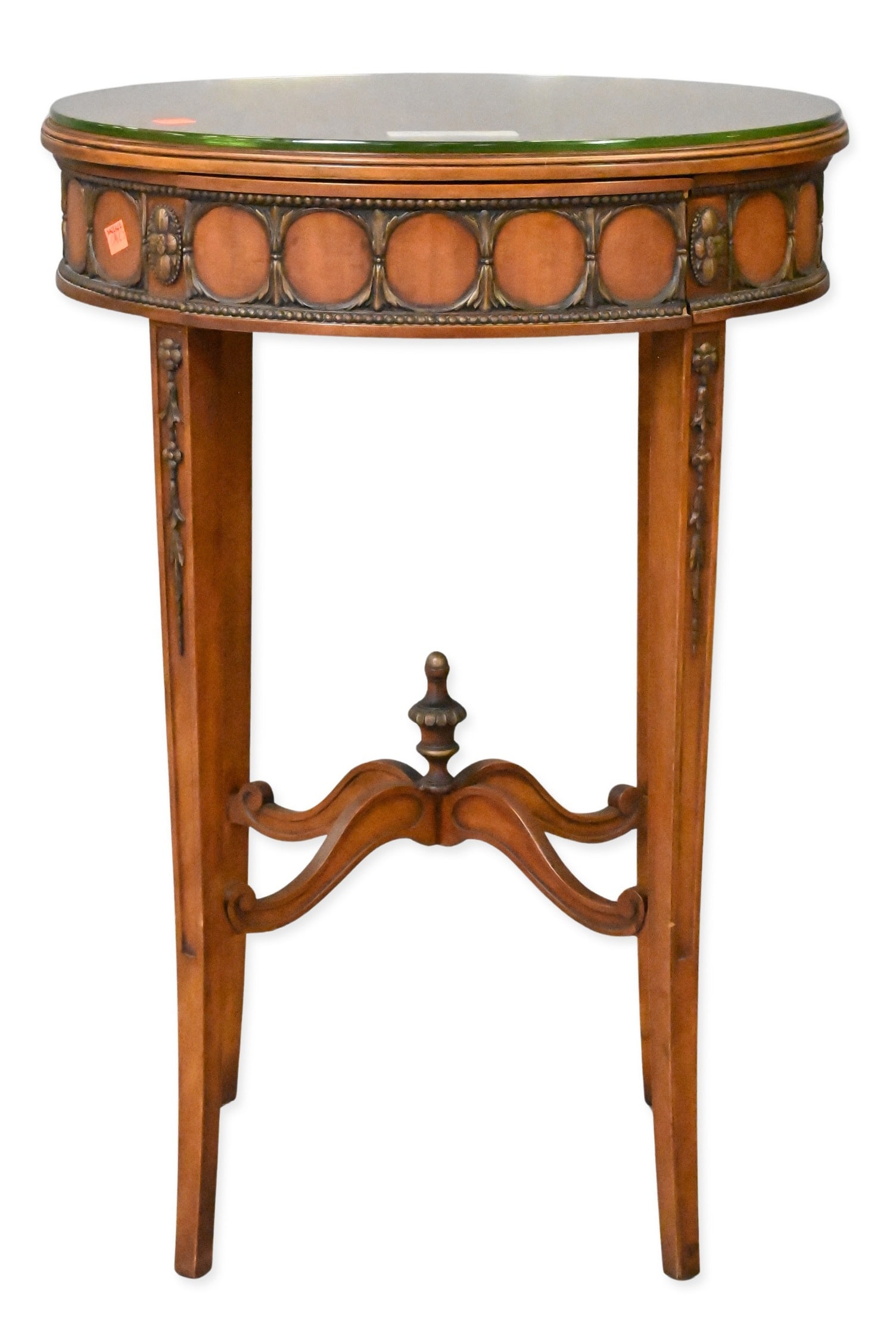 John Widdicomb Sheraton Style Side Table: John Widdicomb Sheraton Style Side Table Oval glass cover top above a single drawer, raised on tapered legs joined by a shaped stretcher, decorated in brass mounts and floral wreath motifs. Retaining 