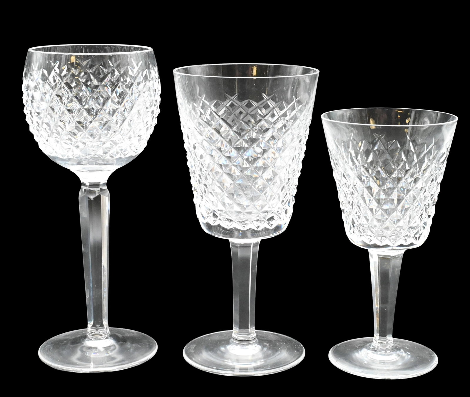 34 Piece Waterford "Alana" Crystal Stem Set: 34 Piece Waterford "Alana" Crystal Stem Set to include 12 large red wine goblets, 9 hock or tall stems, 11 white wine, along with 2 decanters tallest stem height 7 1/4 inches