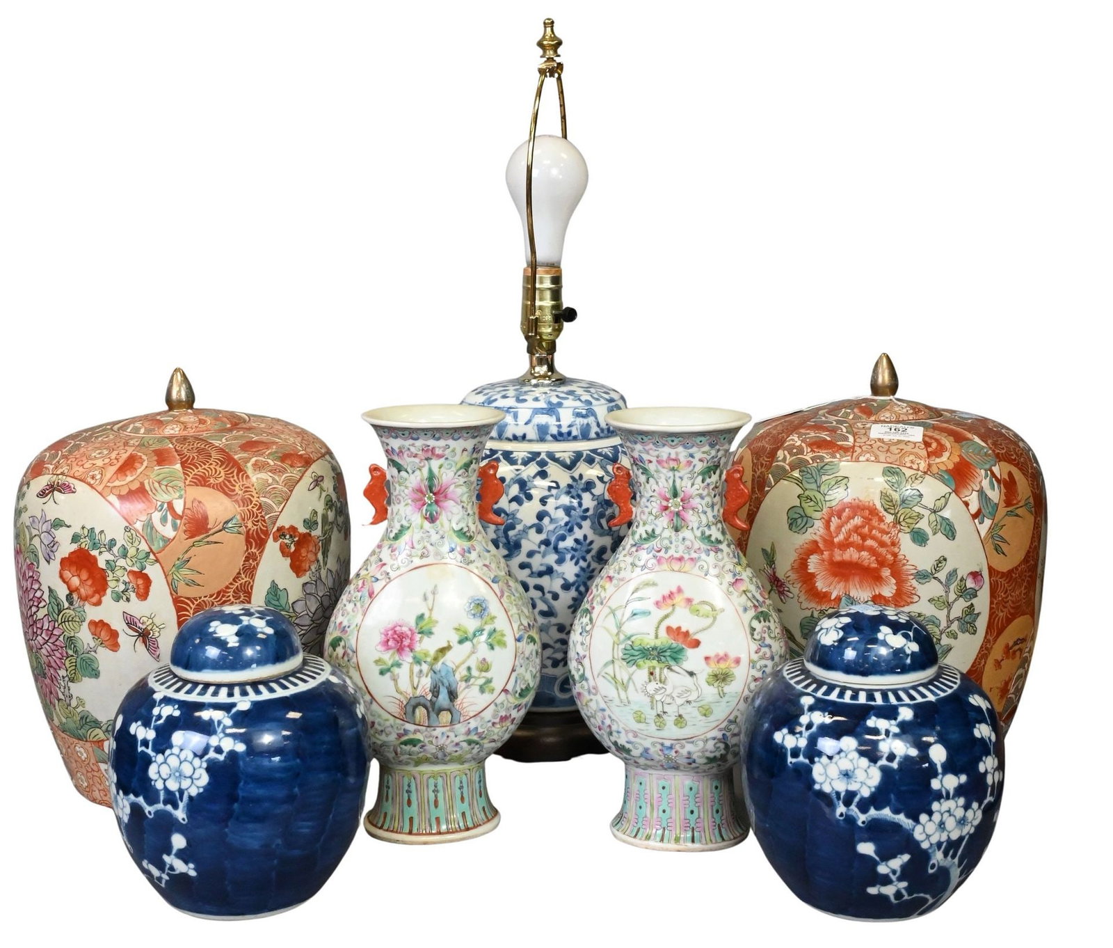 Three Pairs of Decorative Chinese Porcelain Vases: Three Pairs of Decorative Chinese Porcelain Vases comprising a pair of famille rose baluster vases decorated in birds, lotus, and floral scrollwork, a pair of blue and white covered ginger jars decora