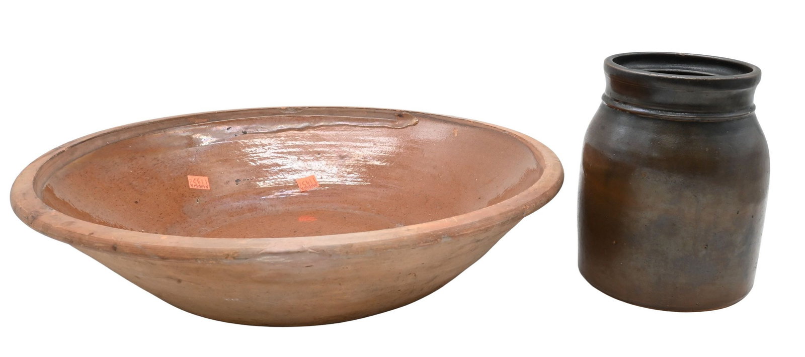 Two Piece 19th Century Redware and Stoneware Lot: Two Piece 19th Century Redware and Stoneware Lot To include a large glazed redware bread mixing bowl, circa 1840, together with a brown glazed stoneware canning jar. Wear and imperfections consistent 