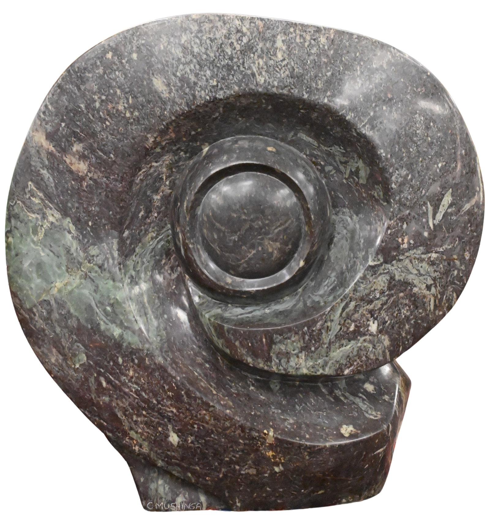 C. Mushinga (Zimbabwe 20th/21st Century): C. Mushinga (Zimbabwe 20th/21st Century) Dual Sided Form Carved stone dual sided sculpture of an eye to one side and a human figure to other Signed C. Mushinga Height 23 inches, width 23 inches, depth