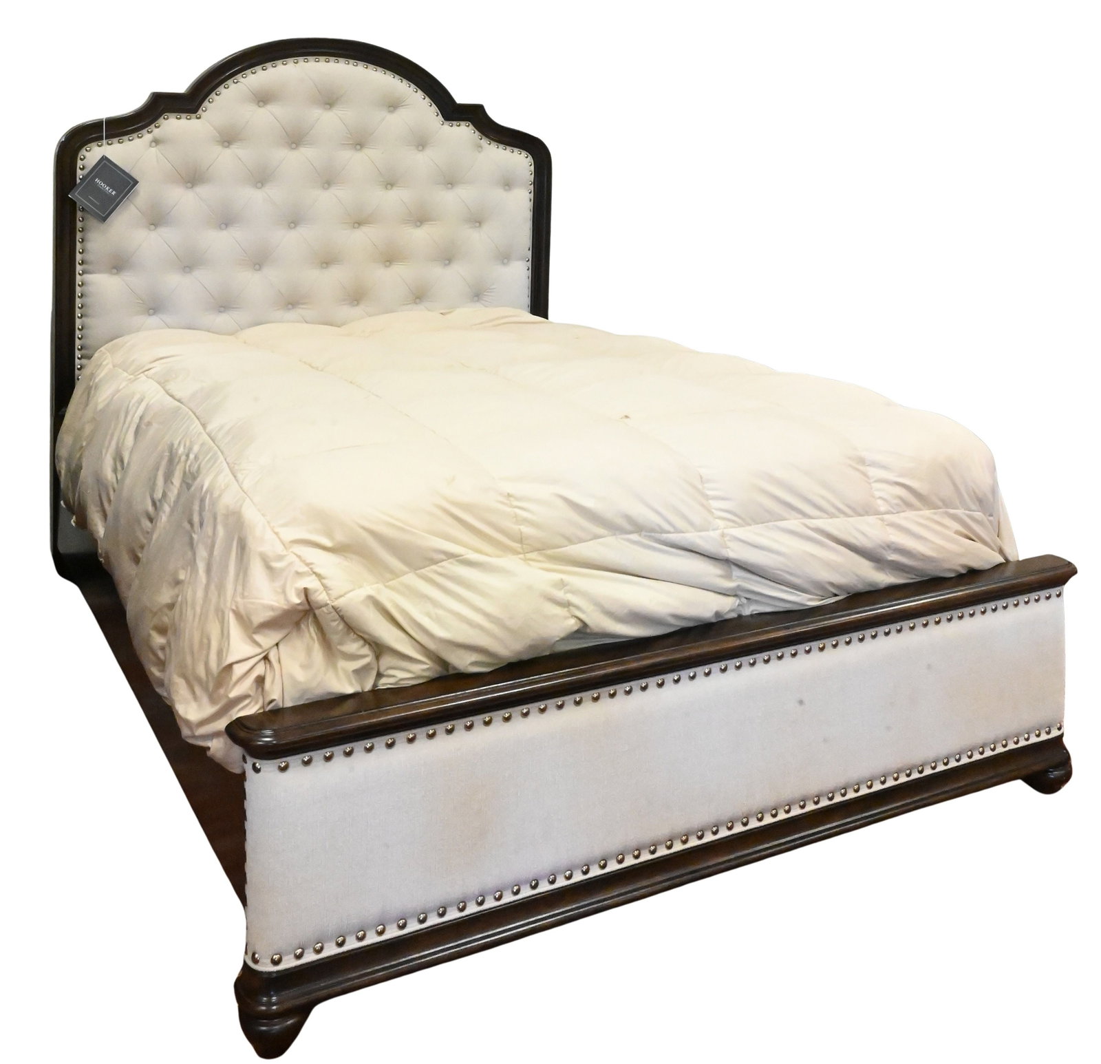 Hooker Furniture Queen Size "Leesburg" Upholstered Bed: Hooker Furniture Queen Size "Leesburg" Upholstered Bed mahogany bed having an arched upholstered headboard and matching footboard, raised on molded supports in the traditional style. Headboard height 
