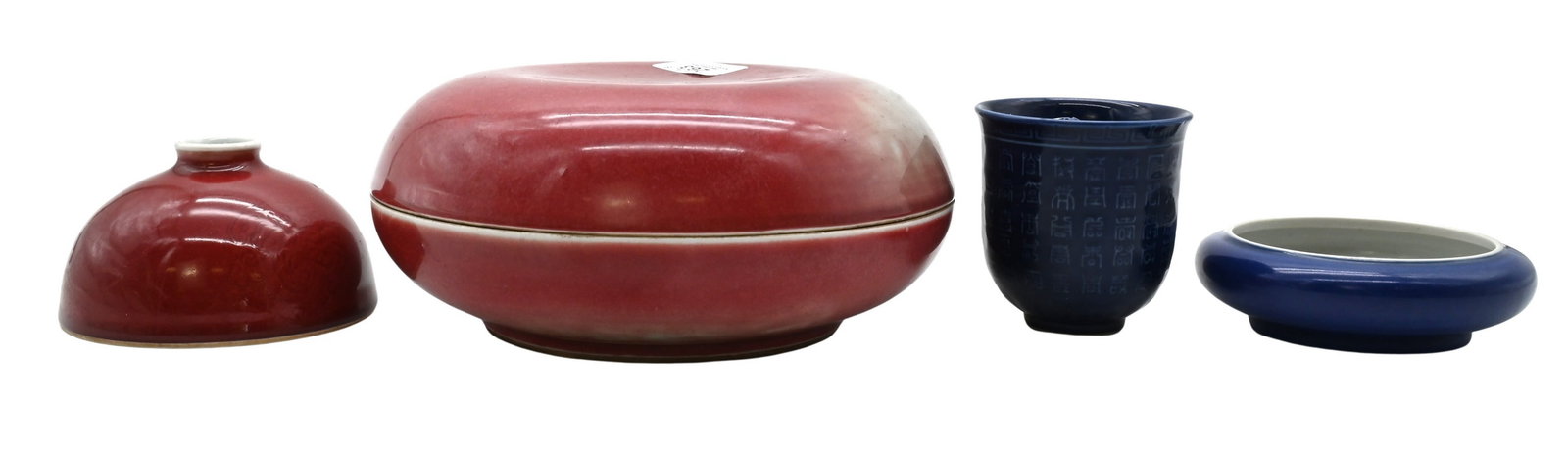 Four Chinese Monochrome Glazed Porcelain Articles: Four Chinese Monochrome Glazed Porcelain Articles to include one powder blue glazed brush washer featuring an iron red landscape decorated interior and bearing a blue and white mark to the underside,