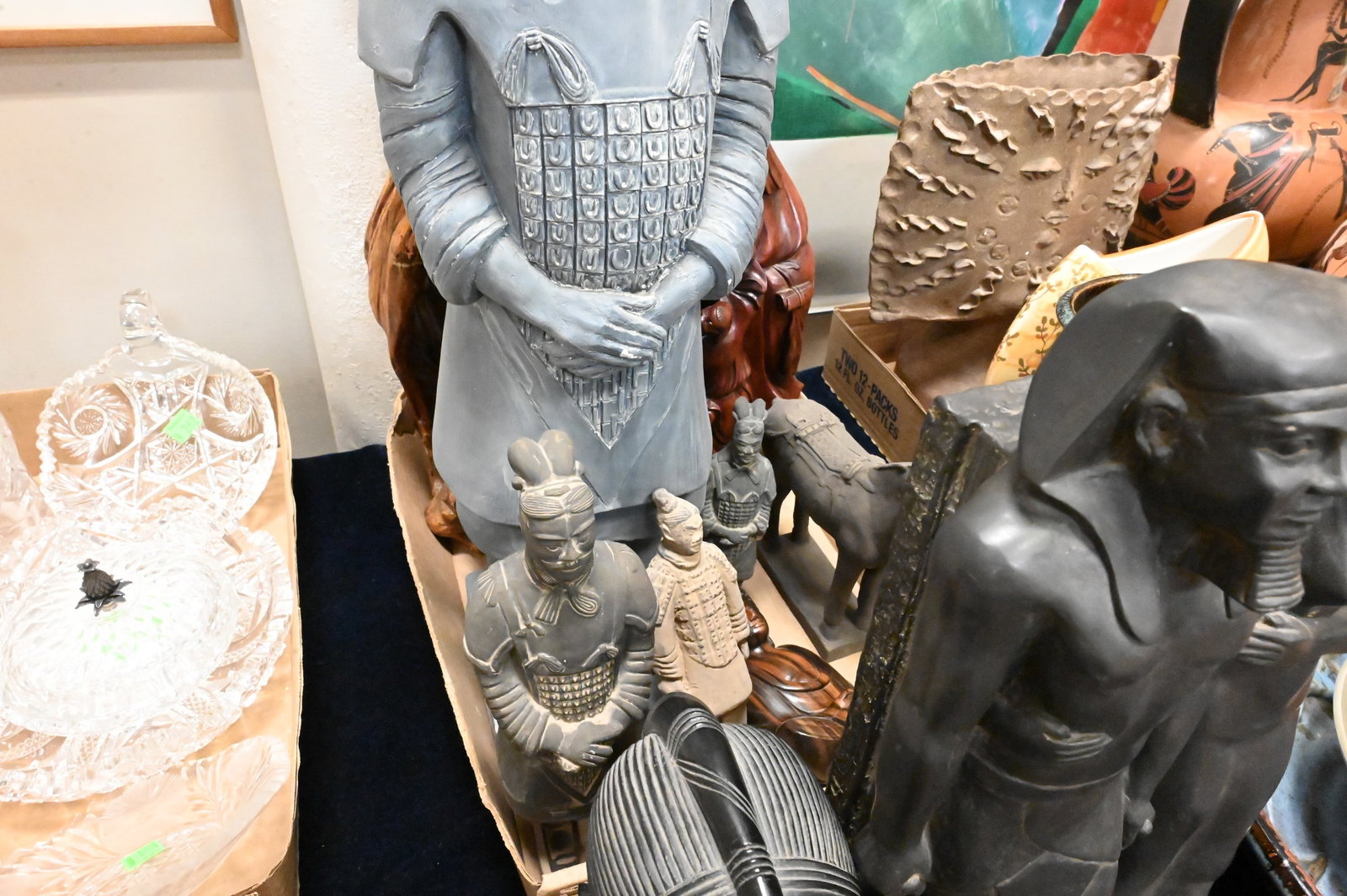 Two Box Lots of Asian and African Decorative Articles: Two Box Lots of Asian and African Decorative Articles Including Alva Museum Replicas terracotta warriors and Tang-style horse figures, reproduction Egyptian pharaoh and royal couple sculptures, carved