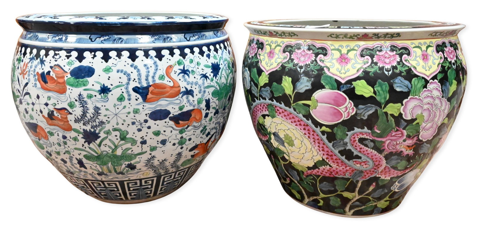 Two Large Chinese Fish Bowl Planters: Two Large Chinese Fish Bowl Planters one jardiniere decorated with waterfowl and aquatic plants, one having dragon amongst scrolling vines and flowers heights 18 inches, 19 inches