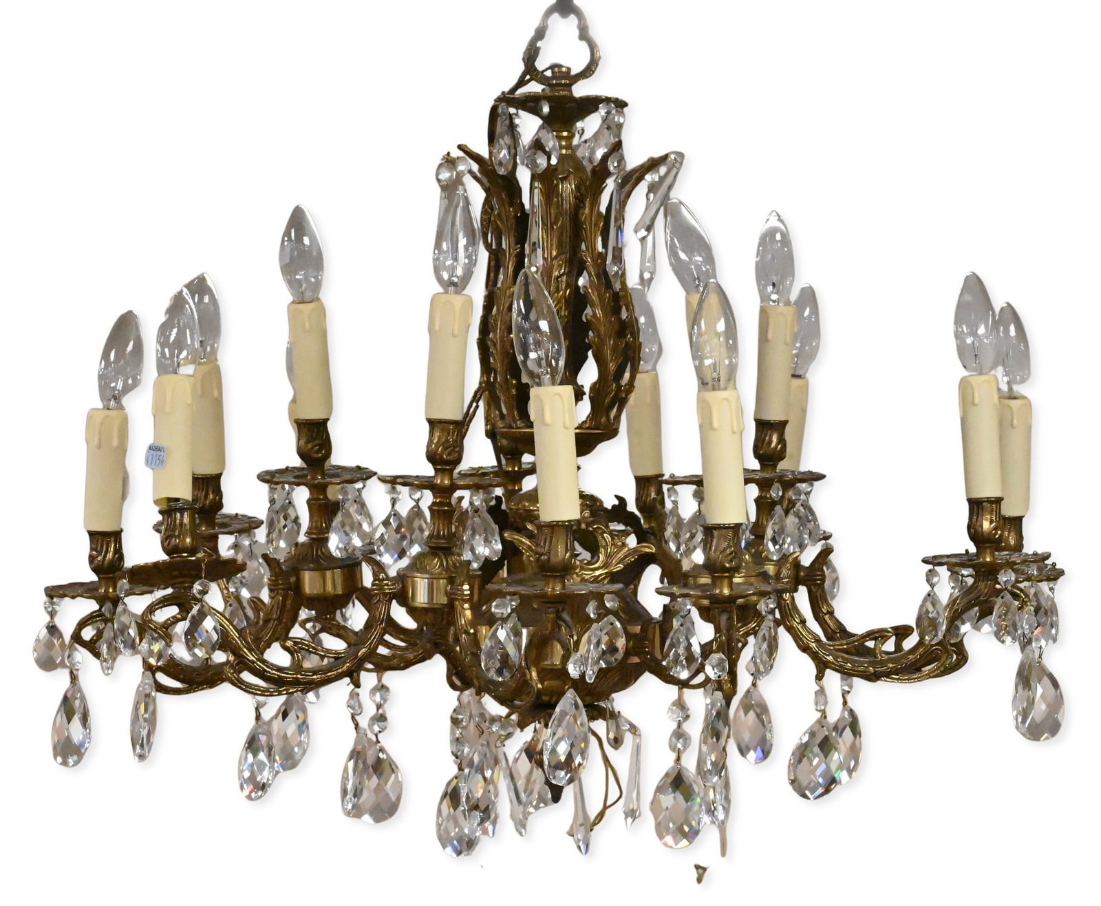 French Rococo Style Brass and Crystal 15 Light Chandelier: French Rococo Style Brass and Crystal 15 Light Chandelier Decorative 15 light chandelier having scrolling bronze arms, candle-form sockets, and faceted crystal prism drops diameter approximately 25 in