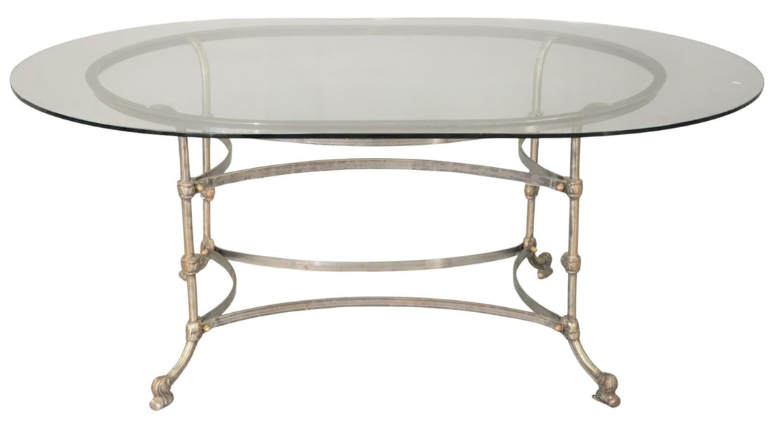 Custom French Oval Glass-Top Dining Table: Custom French Oval Glass-Top Dining Table having an oval glass top raised on a wrought iron base with scrolling supports and stretcher. Height 29 1/2 inches, top 46 1/2" x 72 1/2"