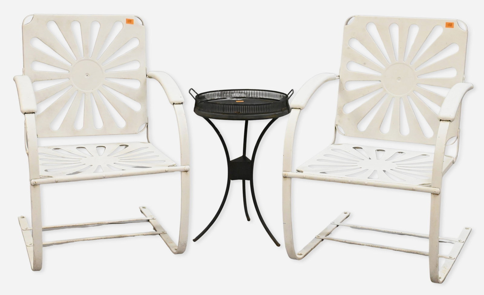 Pair of François Carre Style Sunburst Cantilever Chairs: Pair of François Carre Style Sunburst Cantilever Chairs Mid Century white painted metal outdoor rocking chairs featuring radiating sunburst backs and seats, together with a black metal tray-top occas
