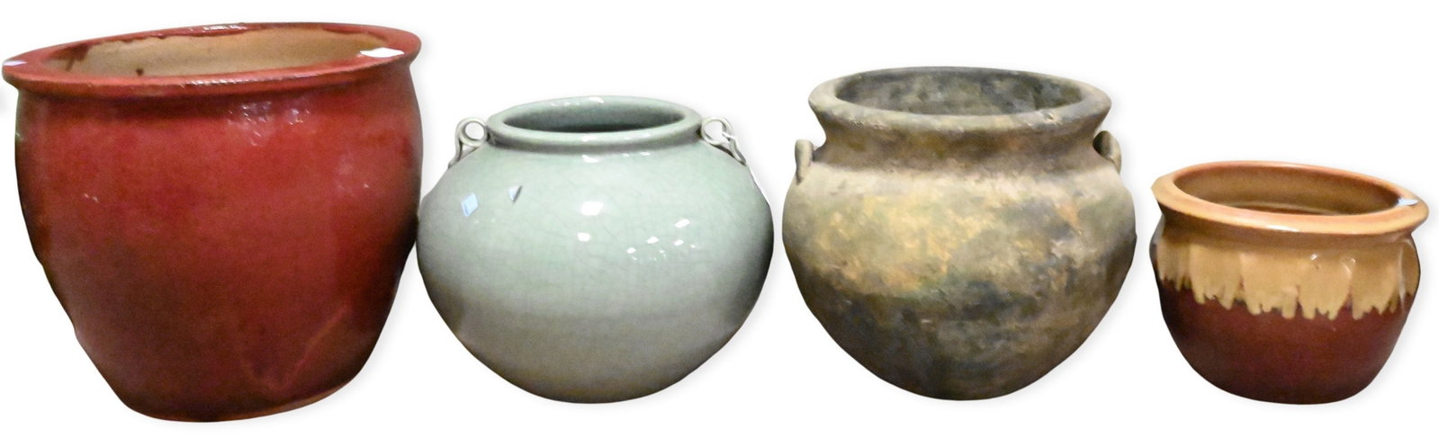 Seven Piece Jardiniere Group: Seven Piece Jardiniere Group to include pair of raffia wrapped handled jugs, large ox blood red planter, double handled crackle glaze celadon, green clover motif planter, etc... tallest height 14