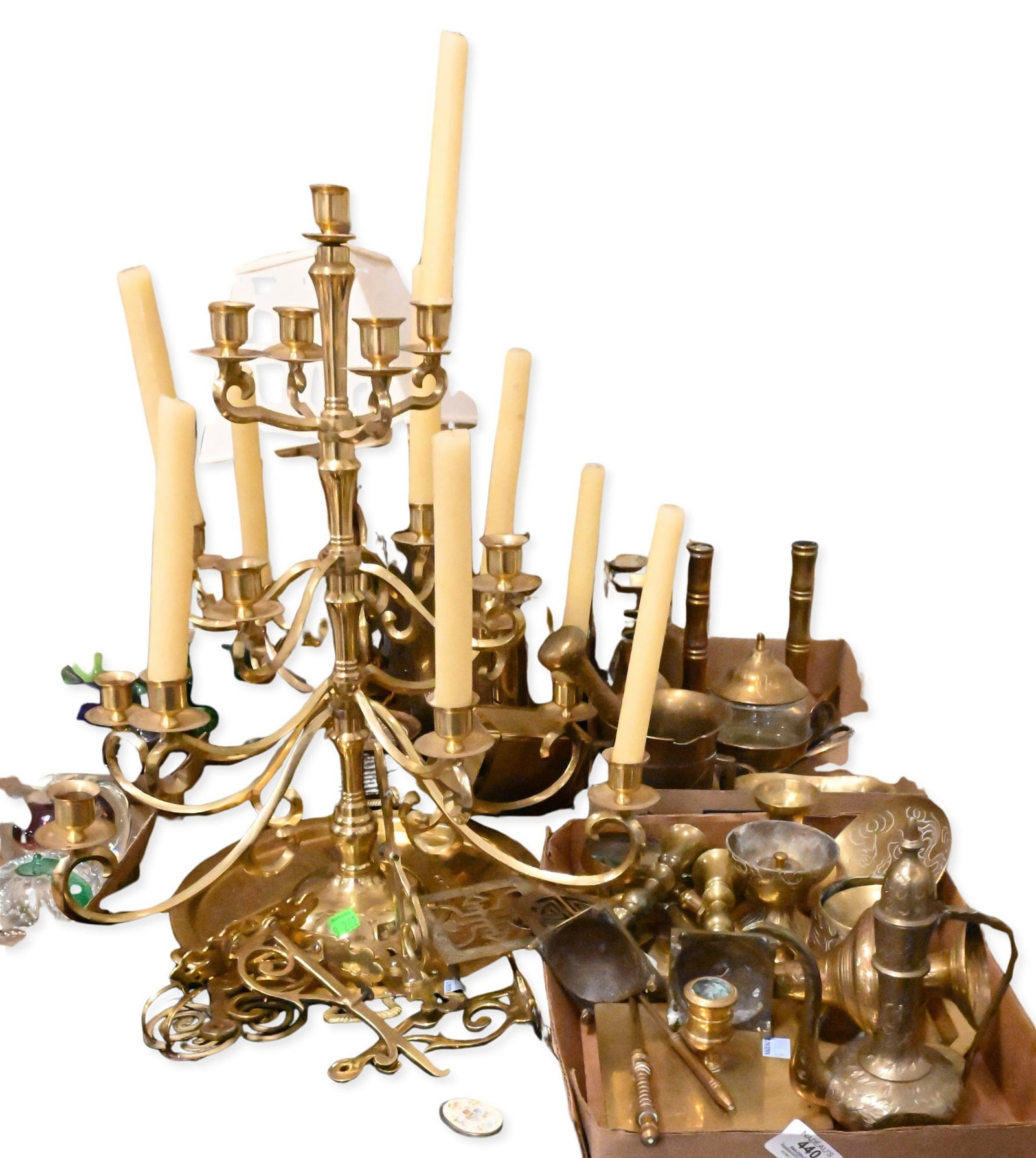 Lot of Assorted Brass Decorative Articles: Lot of Assorted Brass Decorative Articles including Turkish coffee pots, engraved trays, candlesticks, chambersticks, ewers, lidded vessels, vases, a mortar and pestle, magnifying glass, and other dec