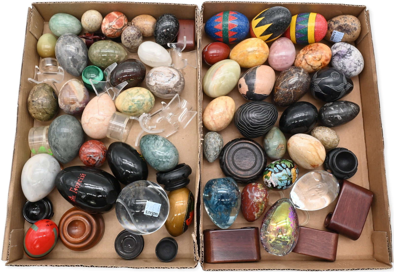 Collection of Approximately 50 Decorative Eggs: Collection of Approximately 50 Decorative Eggs including polished hardstone specimen eggs in a variety of materials such as malachite, onyx, marble, jasper, serpentine, and other stones, Russian lacqu