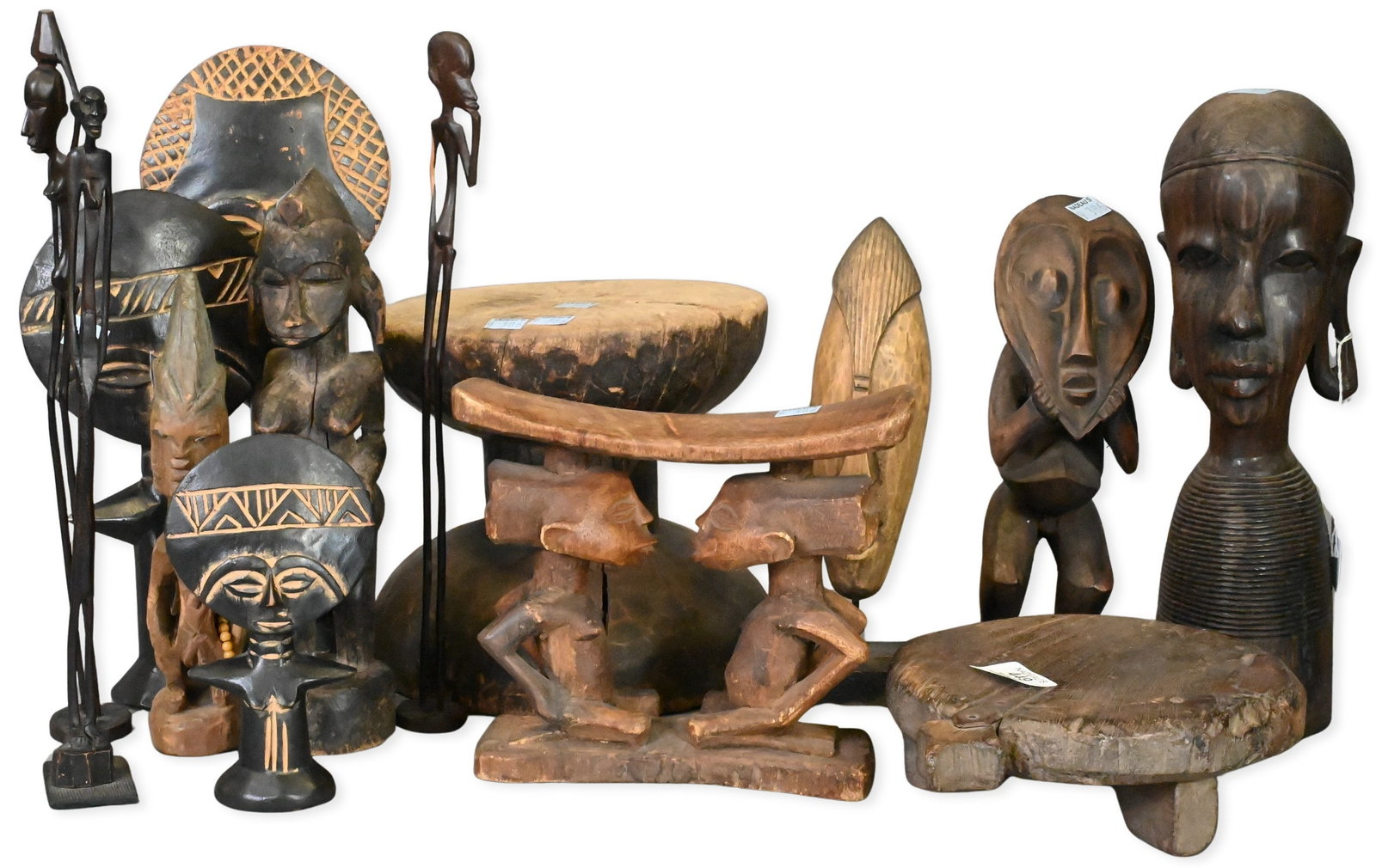 13 African Carved Wood Figures: 13 African Carved Wood Figures including standing male and female figures, elongated forms, equestrian figure, and other carvings attributed to the Baule, Senufo, Lega, Yoruba, and Dogon peoples, 20th