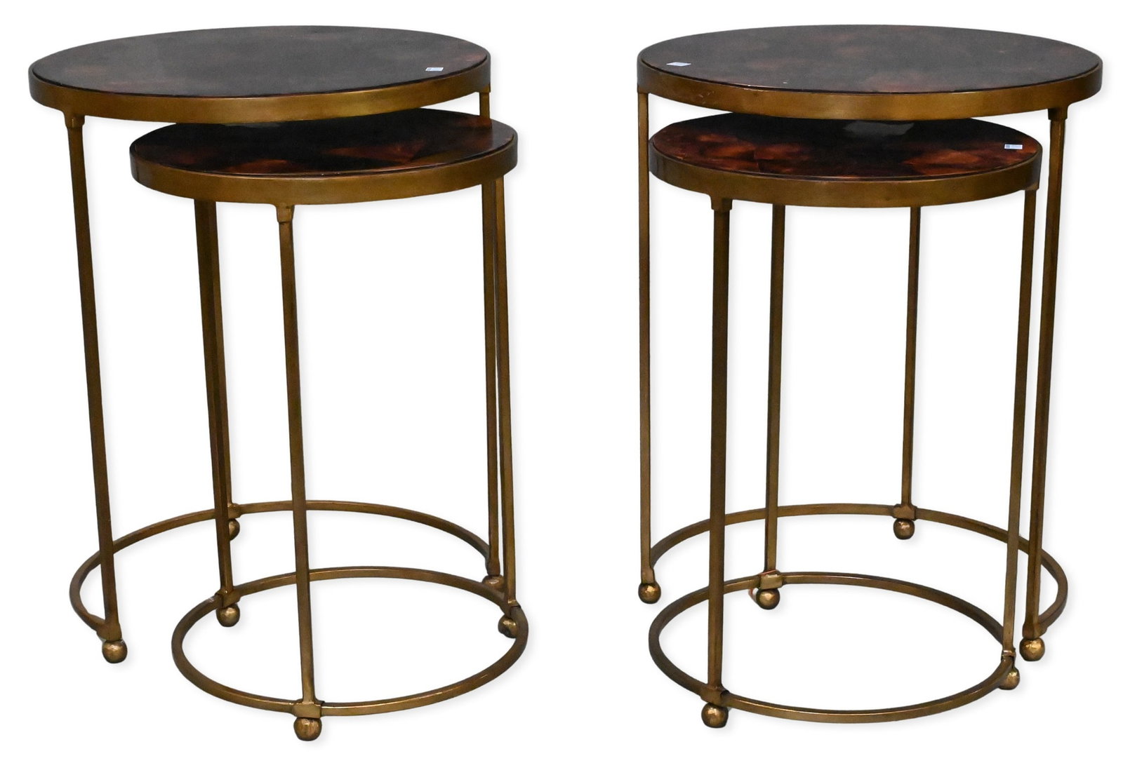 Pair of Nesting Tables: Pair of Nesting Tables having gold trim with faux tortoise tops height 24 1/2 inches and 22 inches, diameter 19 inches and 15 inches