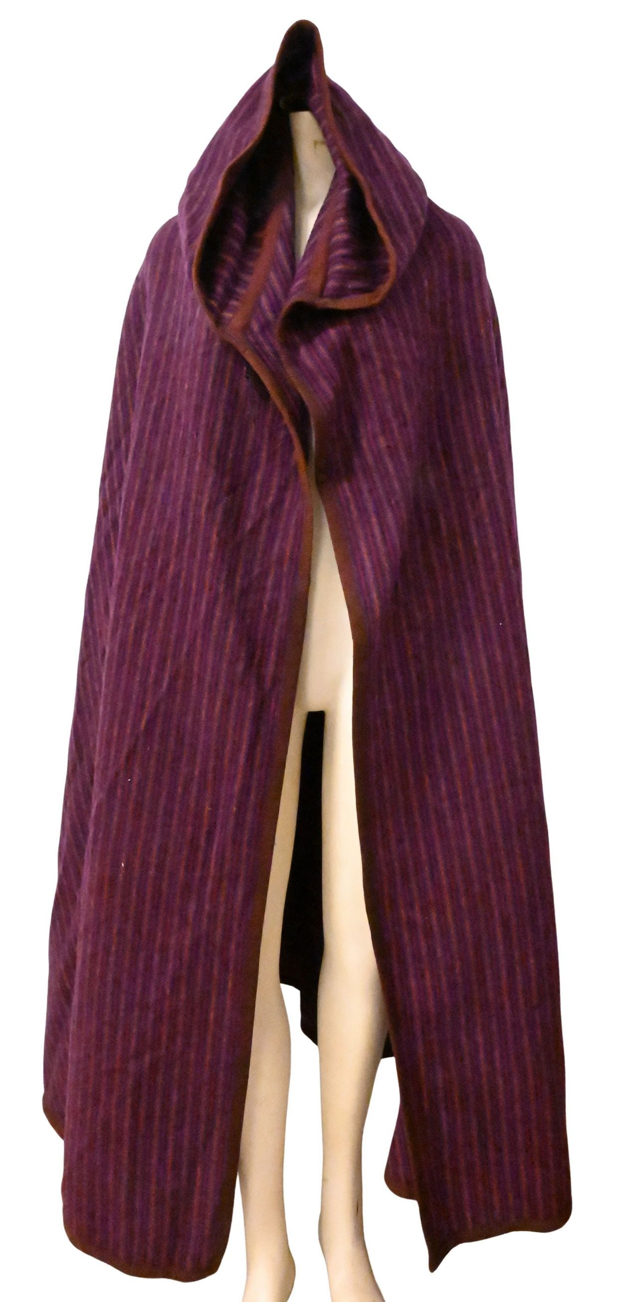 Yves Saint Laurent 1970s Wool Hooded Cloak: Yves Saint Laurent 1970s Wool Hooded Cloak full-length striped wool cloak and hood, single front frog closure clasp, now lacking one, the design consistent with examples from Yves Saint Laurent's