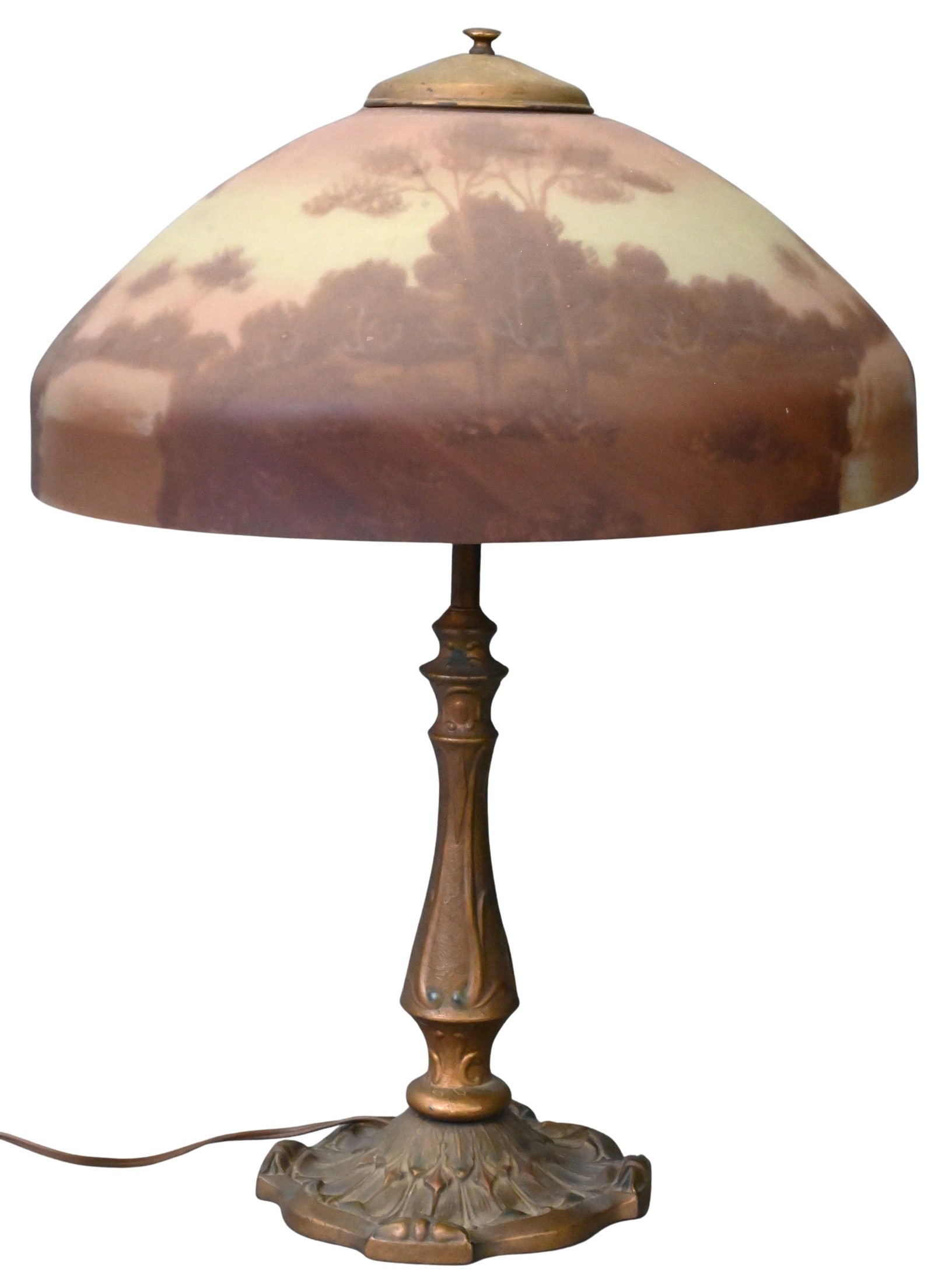 Reverse-Painted Glass Table Lamp: Reverse-Painted Glass Table Lamp possibly by Pittsburgh, omed reverse-painted glass shade depicting a wooded landscape in muted earth tones, raised on a cast metal Art Nouveau style standard and