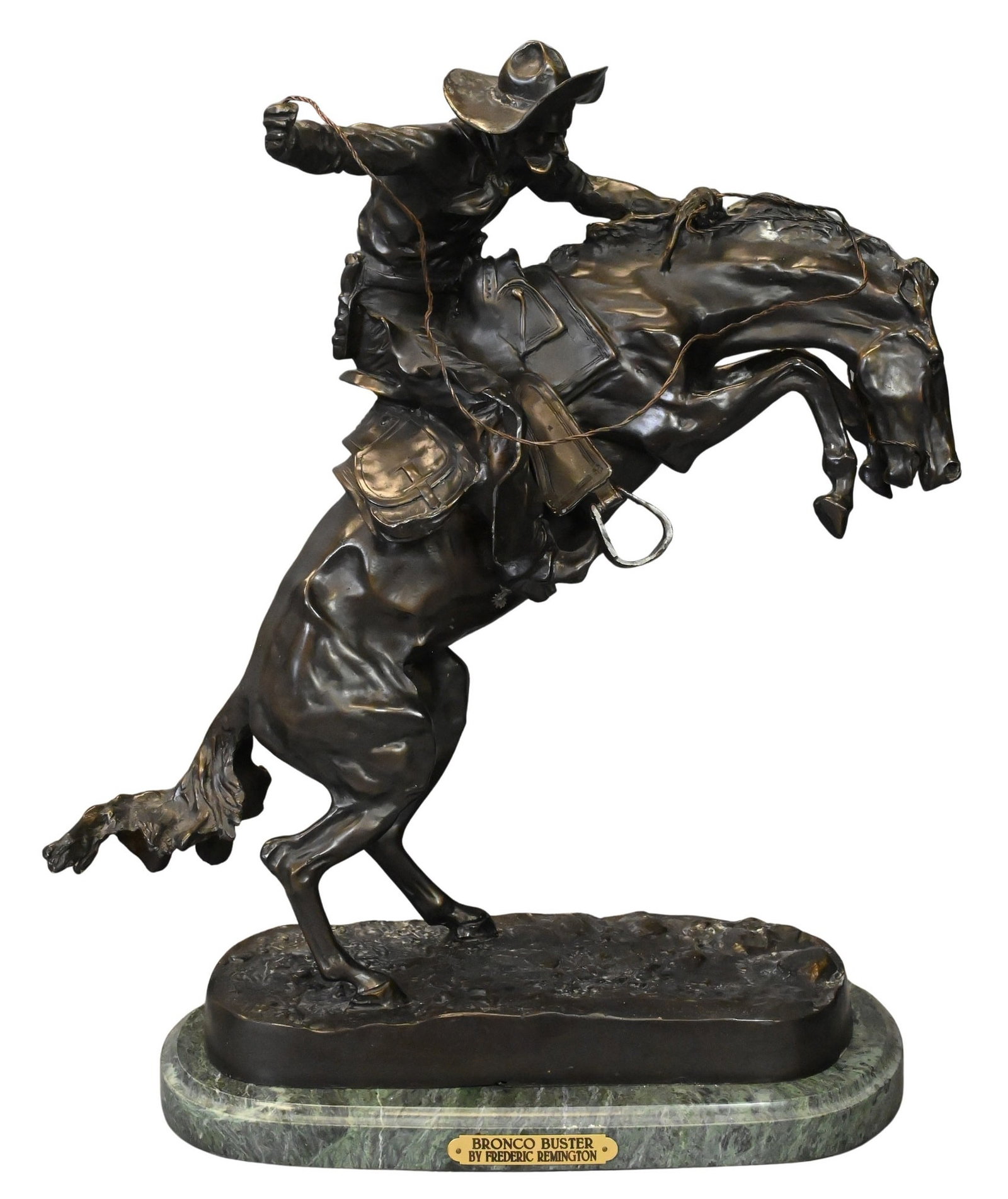 After Frederic Remington (American, 1861–1909): After Frederic Remington (American, 1861–1909) "The Bronco Buster" Bronze on green marble base depicting a cowboy atop a rearing bronco Signed "Frederic Remington" on the base, retaining brass