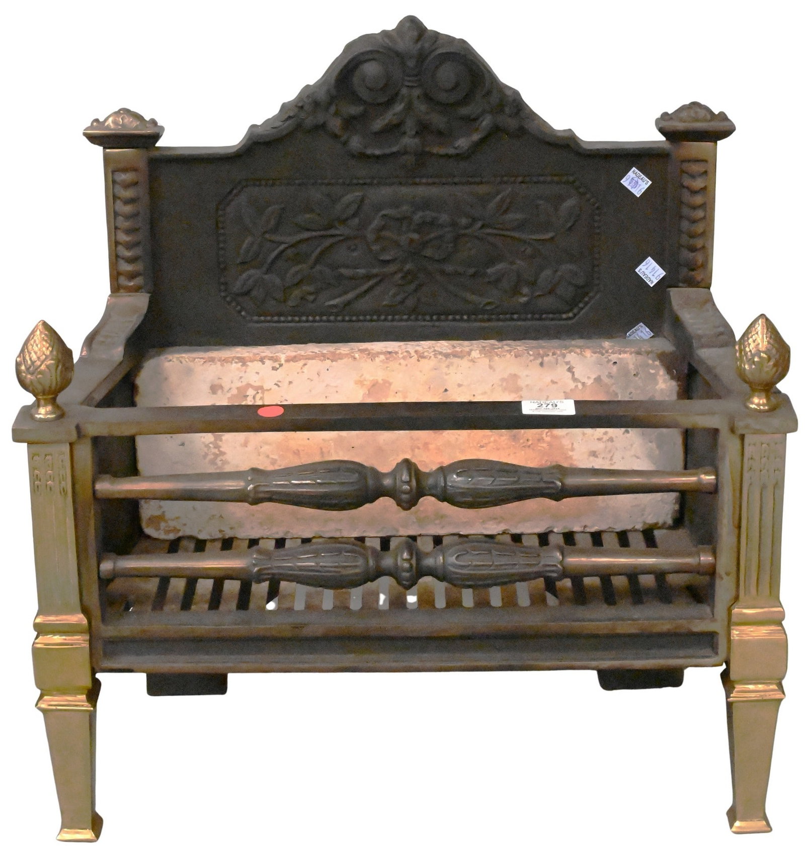 Victorian Iron and Brass Fire Grate: Victorian Iron and Brass Fire Grate backstep having floral motif and set on brass front legs height 23 inches, width 22 inches, depth 10 inches
