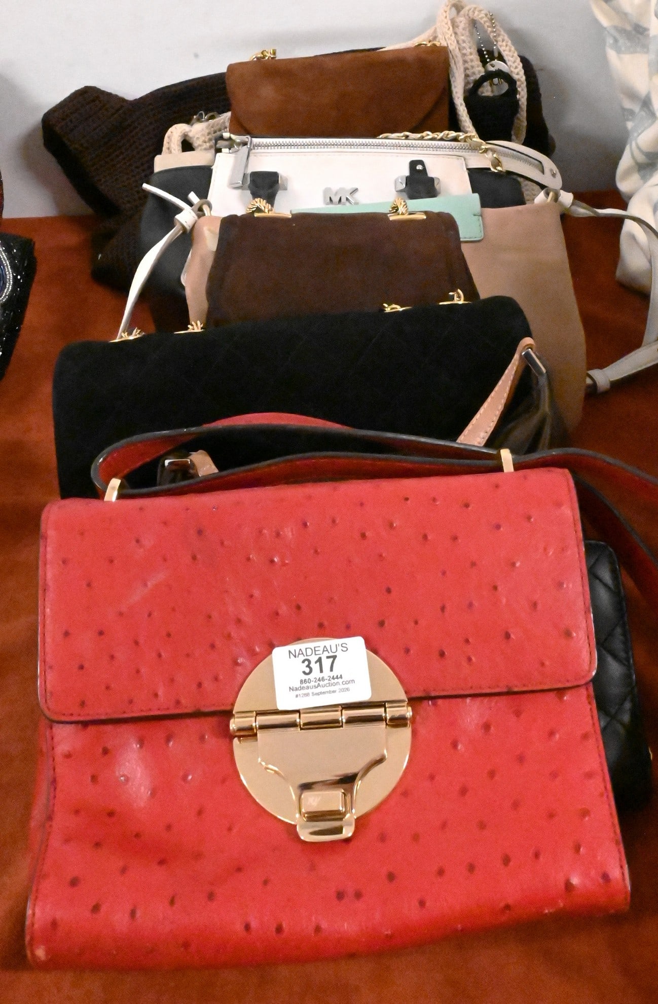 Group of Designer Handbags and Evening Bags: Group of Designer Handbags and Evening Bags To include Sak woven handbags; Marc by Marc Jacobs handbag; Bloomingdale's handbag; Michael Kors faux ostrich leather handbag; Kate Spade handbag; Frenchie