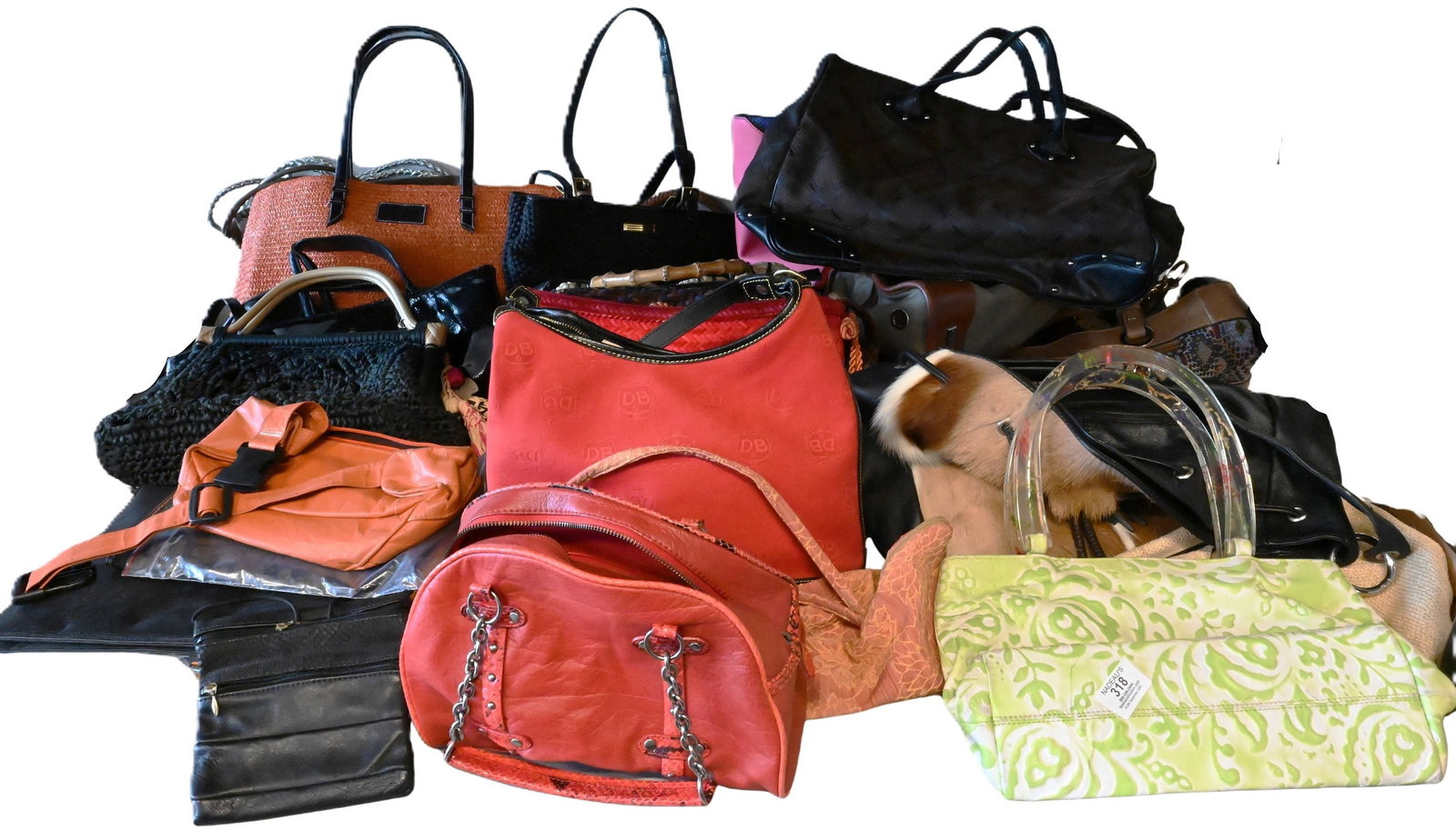 Approximately 25 Women's Purses / Handbags: Approximately 25 Women's Purses / Handbags of various colors, makers, and designers, brands such as: Cynthia Rowley, Kate Spade, Suarez, etc.