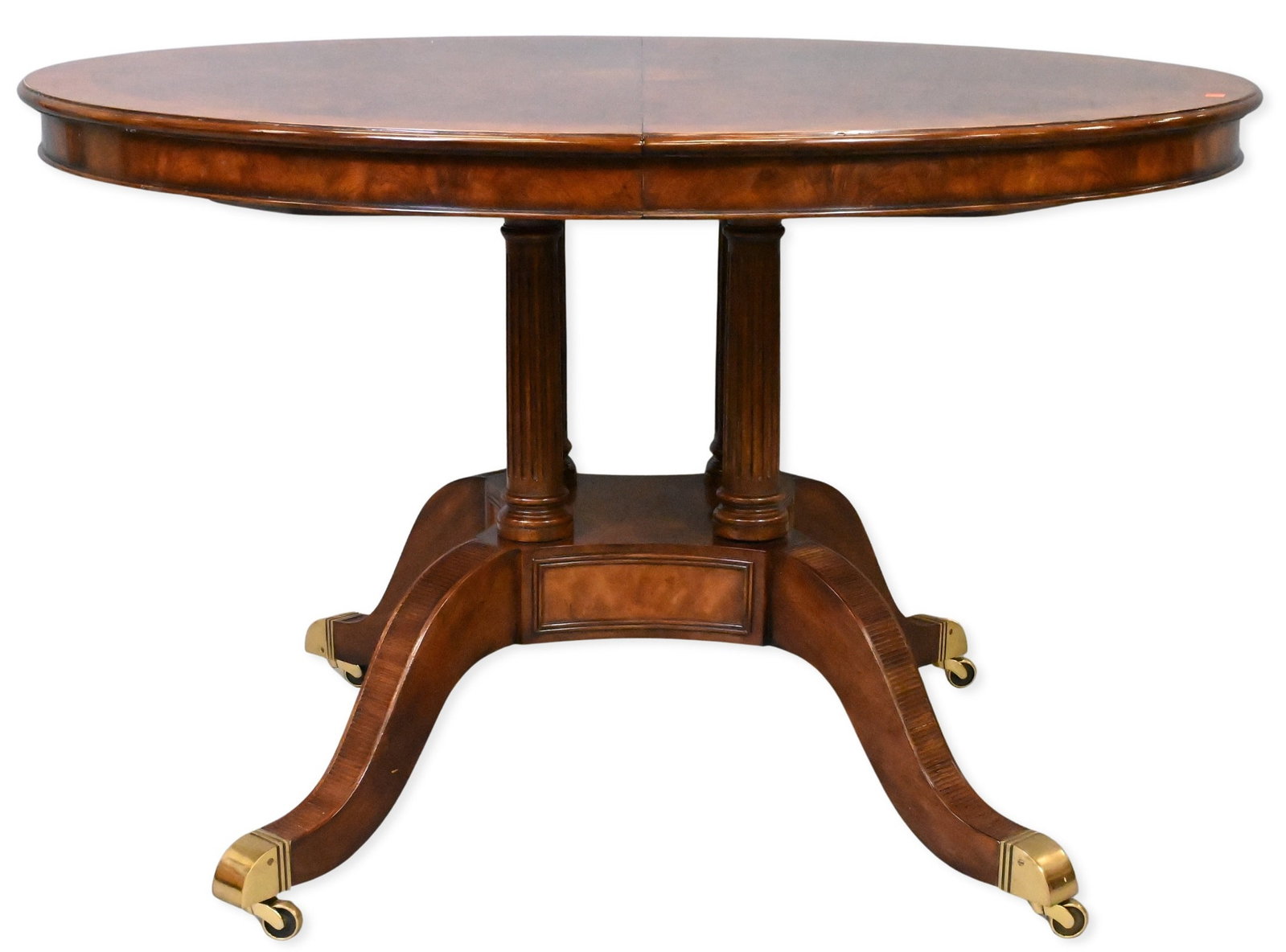 Theodore Alexander Inlaid Center Table: Theodore Alexander Inlaid Center Table having a circular top featuring a burlwood-banded border set on fluted pedestal base, ending in brass capped feet and casters height 30 1/2 inches, diameter 48
