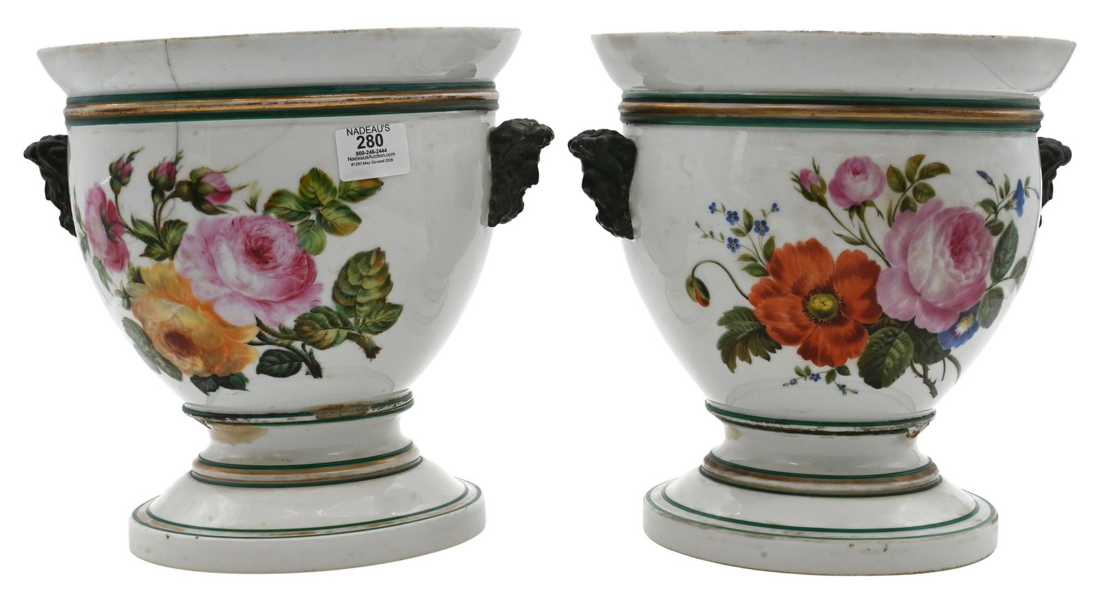 A Pair of French Porcelain Wine Coolers: A Pair of French Porcelain Wine Coolers in two parts having double bust handles and flower motifs, 19th century (chipping and damage) height 11 inches, diameter 10 inches Provenance: From a Park