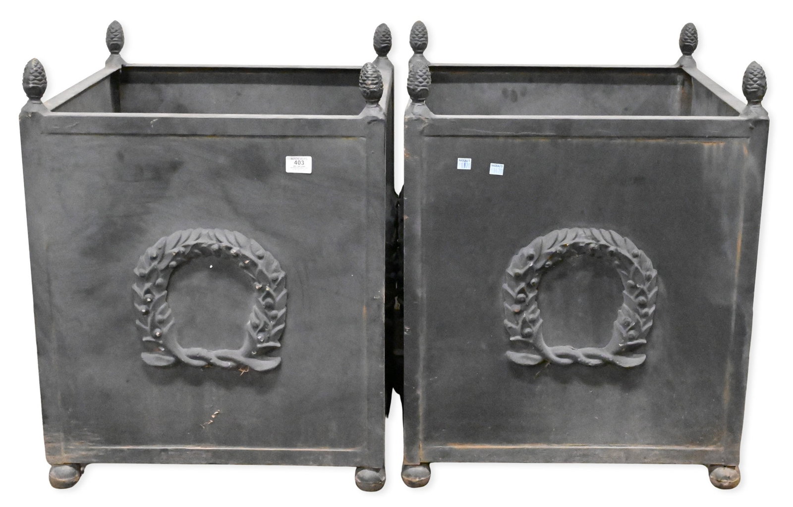 Pair of Large Outdoor Planters: Pair of Large Outdoor Planters each side having laurel wreath motif surmounted by acorn finials height 28", top 21" x 21"