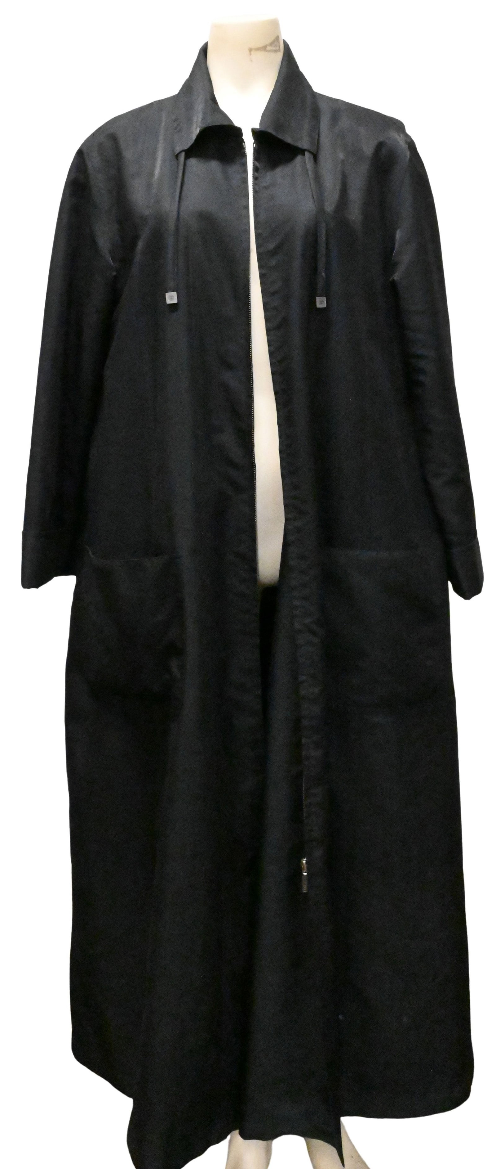 Degand Brussels Black Microfiber Raincoat: Degand Brussels Black Microfiber Raincoat Full-length black microfiber raincoat having a removable zip-out wool liner, concealed front closure, and side pockets size 56 Comparable retail: approximatel