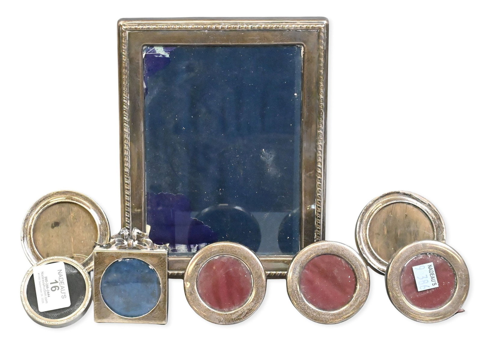 Eight Sterling Silver Picture Frames: Eight Sterling Silver Picture Frames to include a pair of circular frames, three piece circular frame, large rectangular frame along with two small square with bow and circular largest 7" X 9"