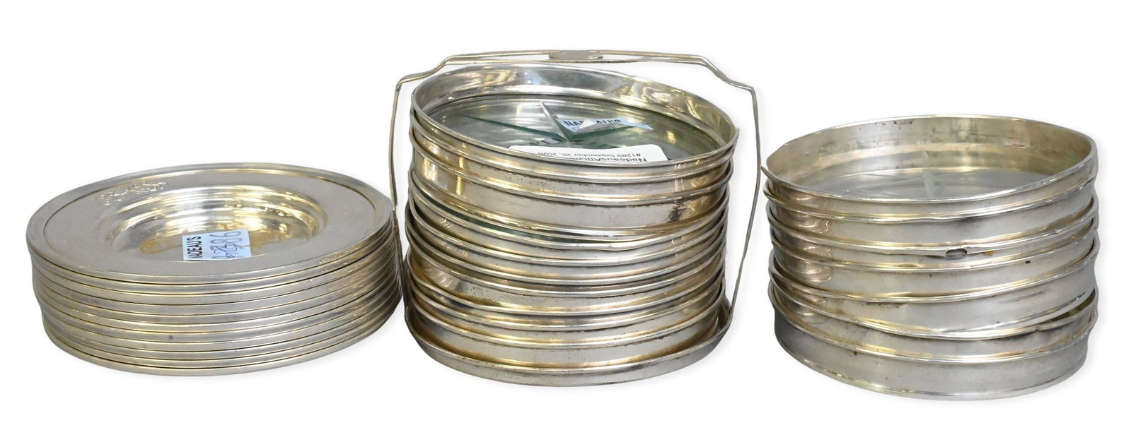 Three Sets of Sterling Silver Coasters: Three Sets of Sterling Silver Coasters one set of 11 solid sterling 3 1/2" diameter, along with two new pair of sterling rimmed glass casters one set of 7 and one set of 10 with carrier total weight