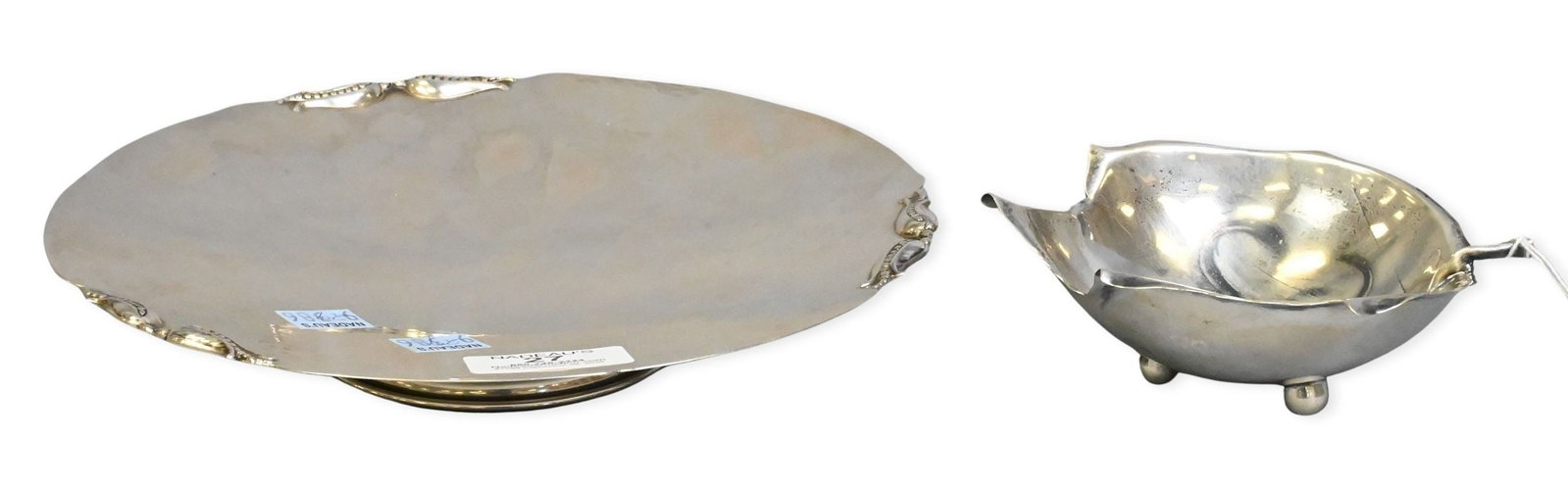 Two Piece Sterling Silver Group: Two Piece Sterling Silver Group to include Carl Paul Peterson footed salver / presentation dish diameter 9 inches along with Alfredo Sciarrotta leaf form dish 4 1/2" X 5 1/2"