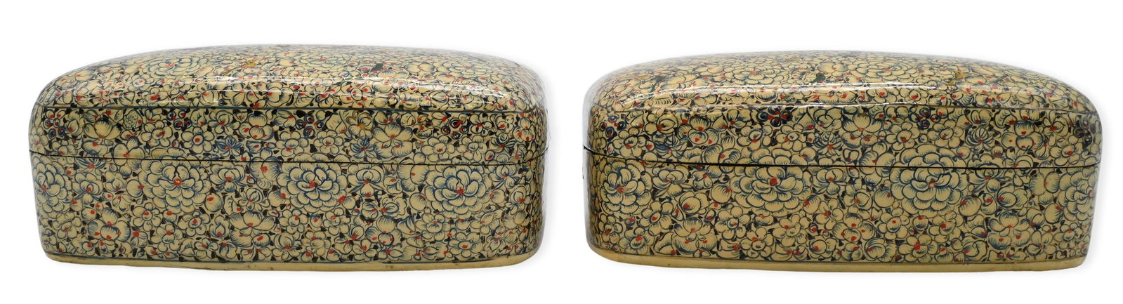 Pair of Kashmiri Painted Papier-Mache Boxes: Pair of Kashmiri Painted Papier-Mache Boxes each having rounded rectangular form with domed lid, finely painted in the gul-andar-gul manner with dense flowering blossoms, foliage and small birds on a