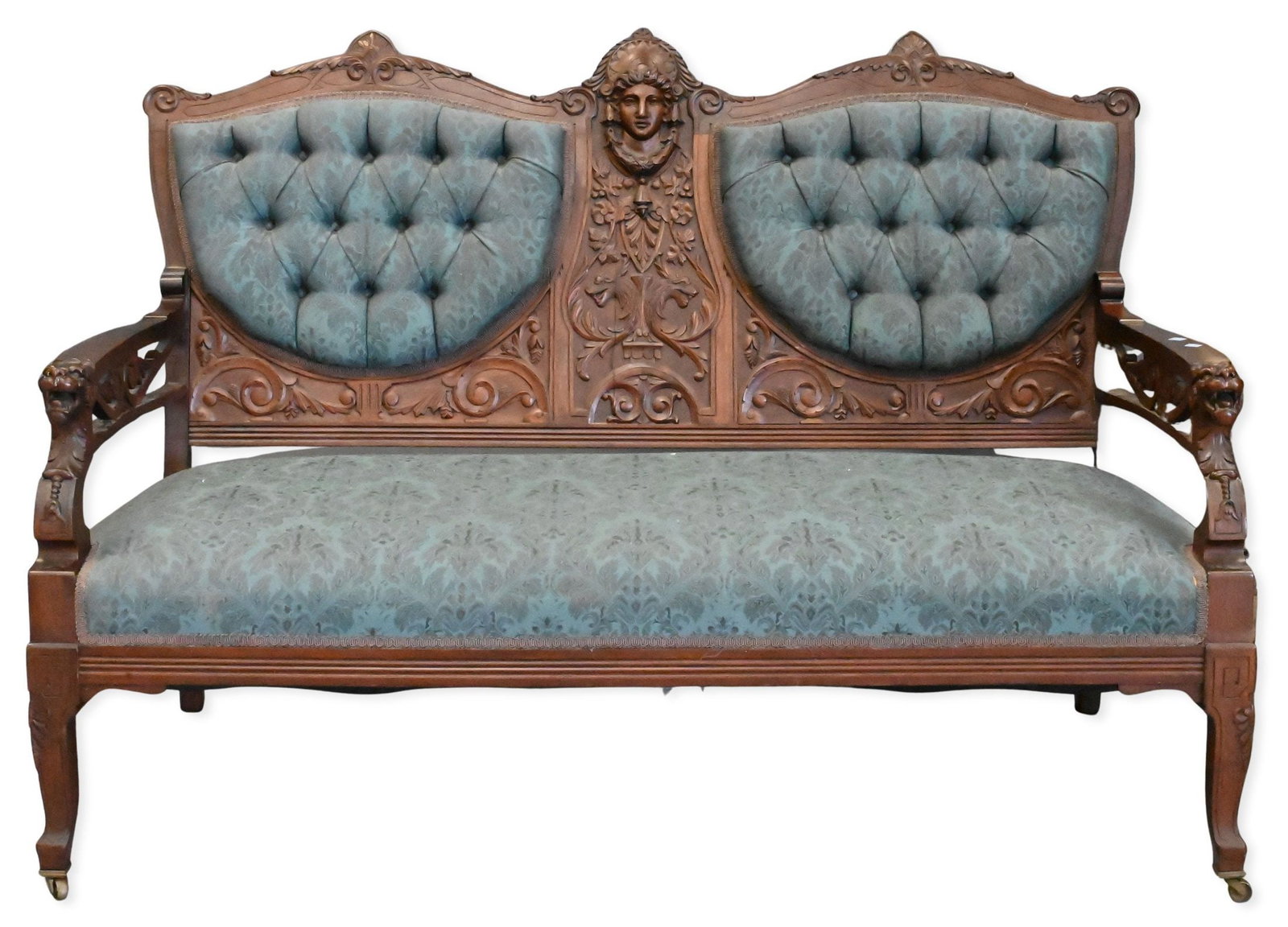 Eastlake Carved Upholstered Loveseat: Eastlake Carved Upholstered Loveseat back having central carved bust and arms having carved griffin headrests height 37 inches, length 55 inches