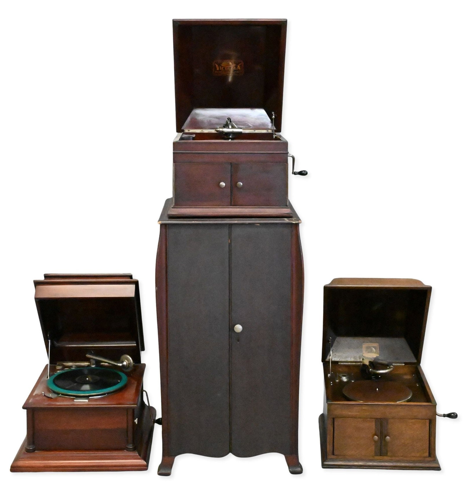 Four Piece Gramophone and Cabinet Group: Four Piece Gramophone and Cabinet Group to include three gramophones, Victor VV-IX Columbia No.88376, and a His Masters Voice model 103, along with a two door cabinet cabinet height 34 inches
