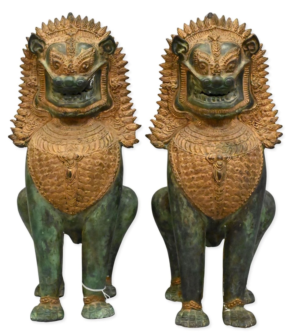 Pair of Thai Verdigris and Gilt Bronze Guardian Lions: Pair of Thai Verdigris and Gilt Bronze Guardian Lions Singha guardian lions or food dog figures, each having verdigris patina, gilt headdress, chest ornament and finely incised decoration throughout,