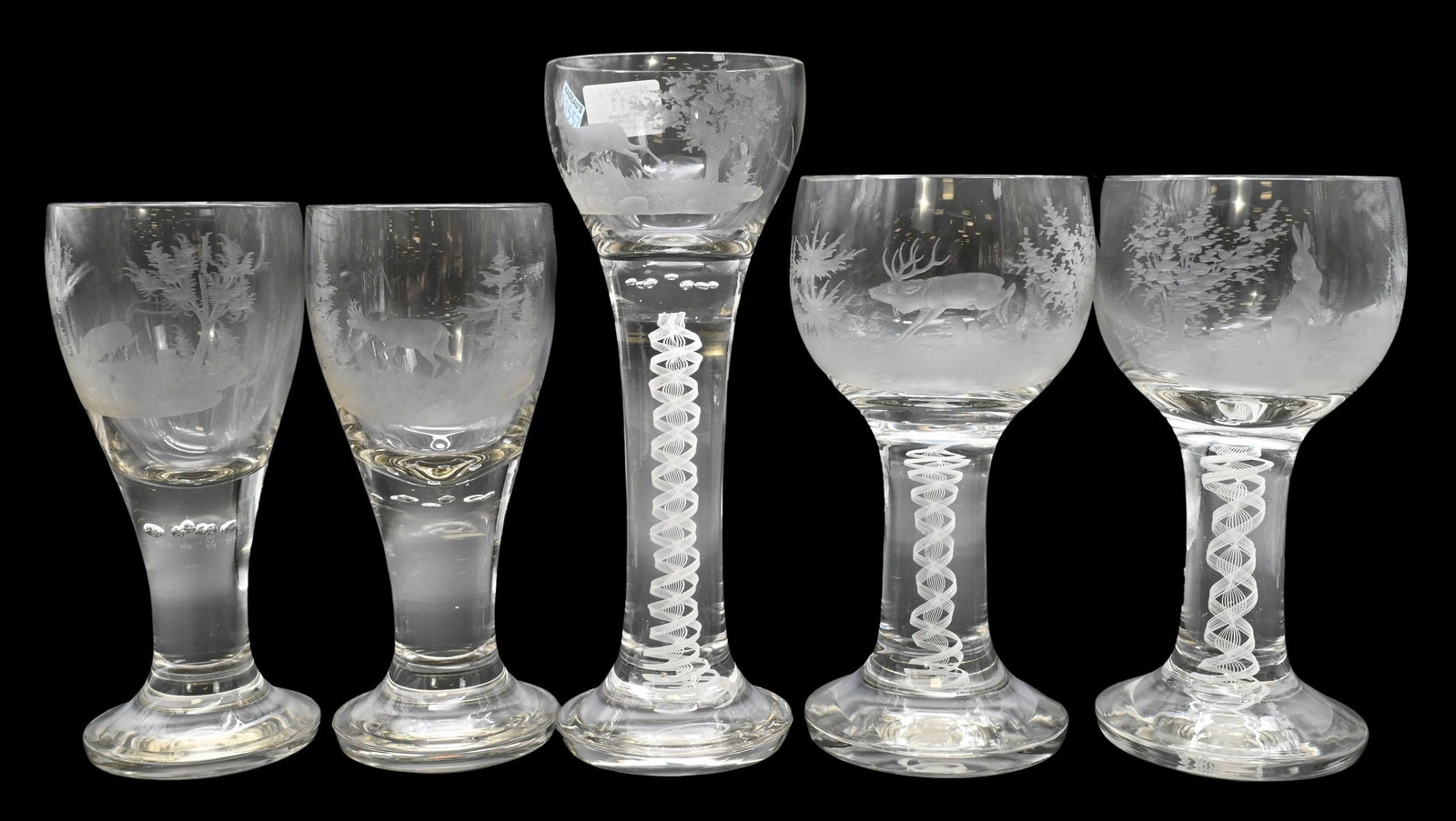 Five Large Georgian Style Engraved Hunting Goblets: Five Large Georgian Style Engraved Hunting Goblets each wheel engraved depicting game animals in woodland landscapes, to include two of deer, one depicting a wild boar, one of a large elk, and one