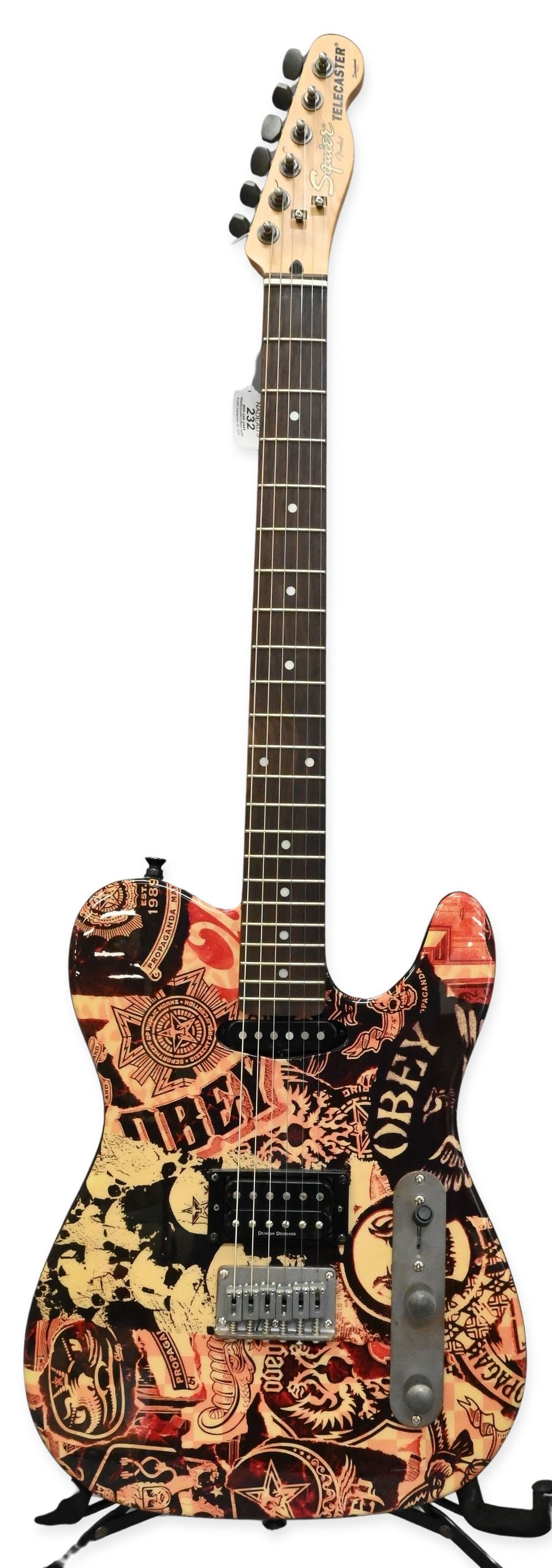 2006 Fender Squier Telecaster "Obey" Electric Guitar: 2006 Fender Squier Telecaster "Obey" Electric Guitar having custom graphics of Shepard Fairey's "Obey", serial number IC060729842. Along with soft case