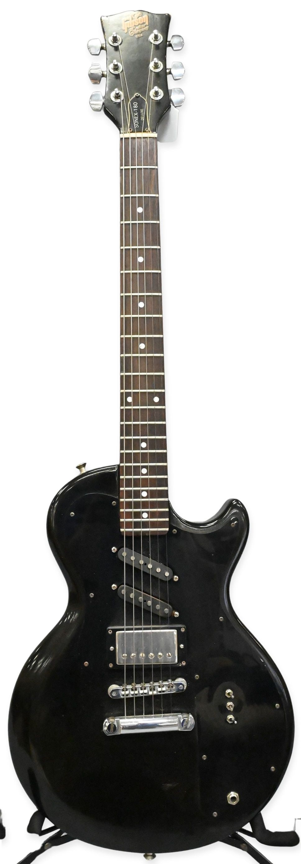 1983 Gibson Sonex-180 Deluxe Electric Guitar: 1983 Gibson Sonex-180 Deluxe Electric Guitar having black finish, Made in the USA, serial number 81821608. Along with Gibson hard case