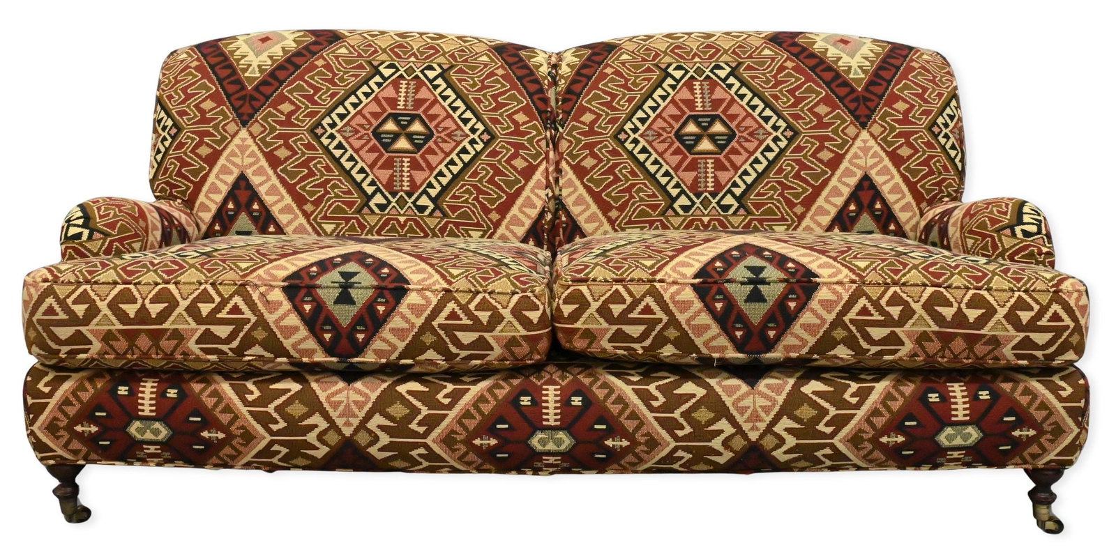 George Smith Style Kilim Upholstered Loveseat: George Smith Style Kilim Upholstered Loveseat having rolled arms and set on turned legs ending in brass casters height 33 inches, length 72 inches, depth 40 inches
