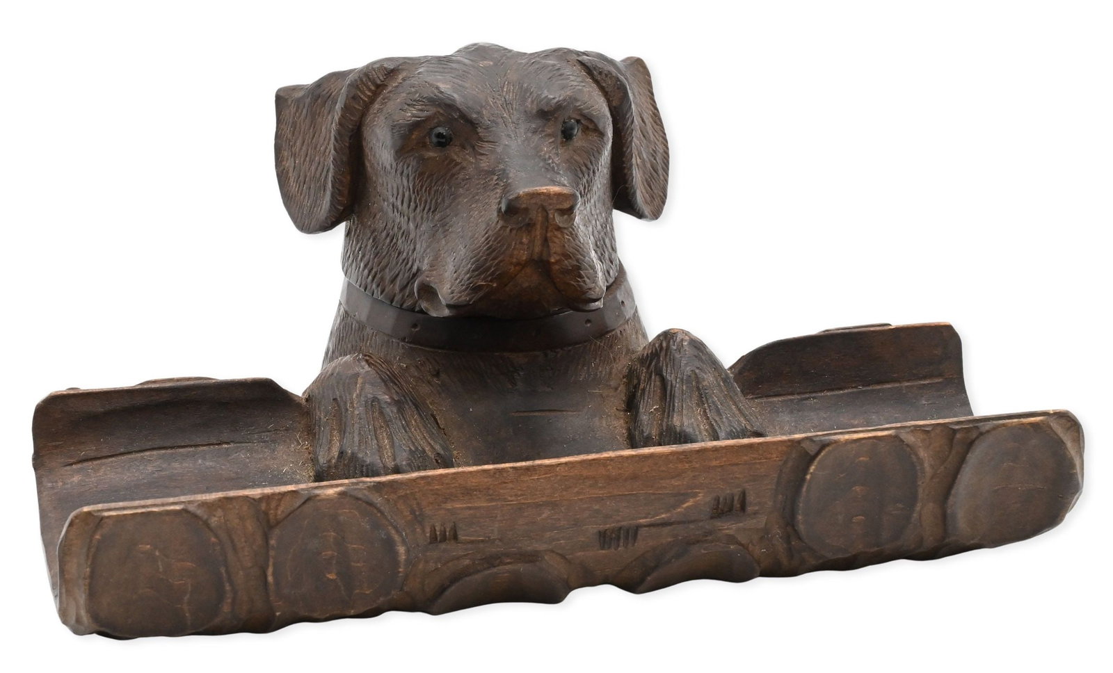 Black Forest Carved Hunting Dog Head Inkwell: Black Forest Carved Hunting Dog Head Inkwell carved wood inkwell depicting an expressive hunting hound head, having front paws resting on a log tray, glass insert intact, late 19th century length 7