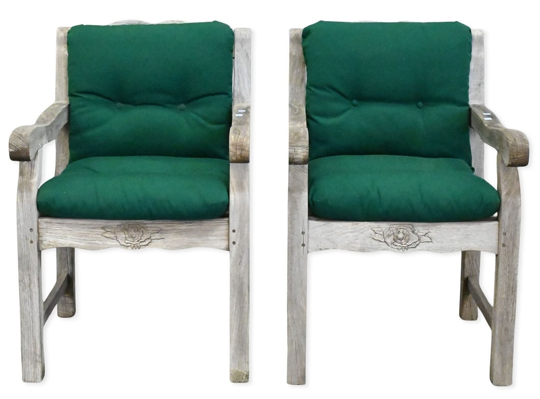 Pair of Outdoor Teak Armchairs: Pair of Outdoor Teak Armchairs each having shaped back with floral motif and cushions height 37 inches, width 24"
