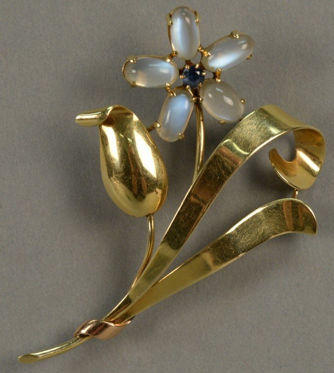 14K Tiffany brooch, floral design set with moonstones: 14K Tiffany brooch, floral design set with moonstones and blue sapphire. ht. 3in. 14.9 grams